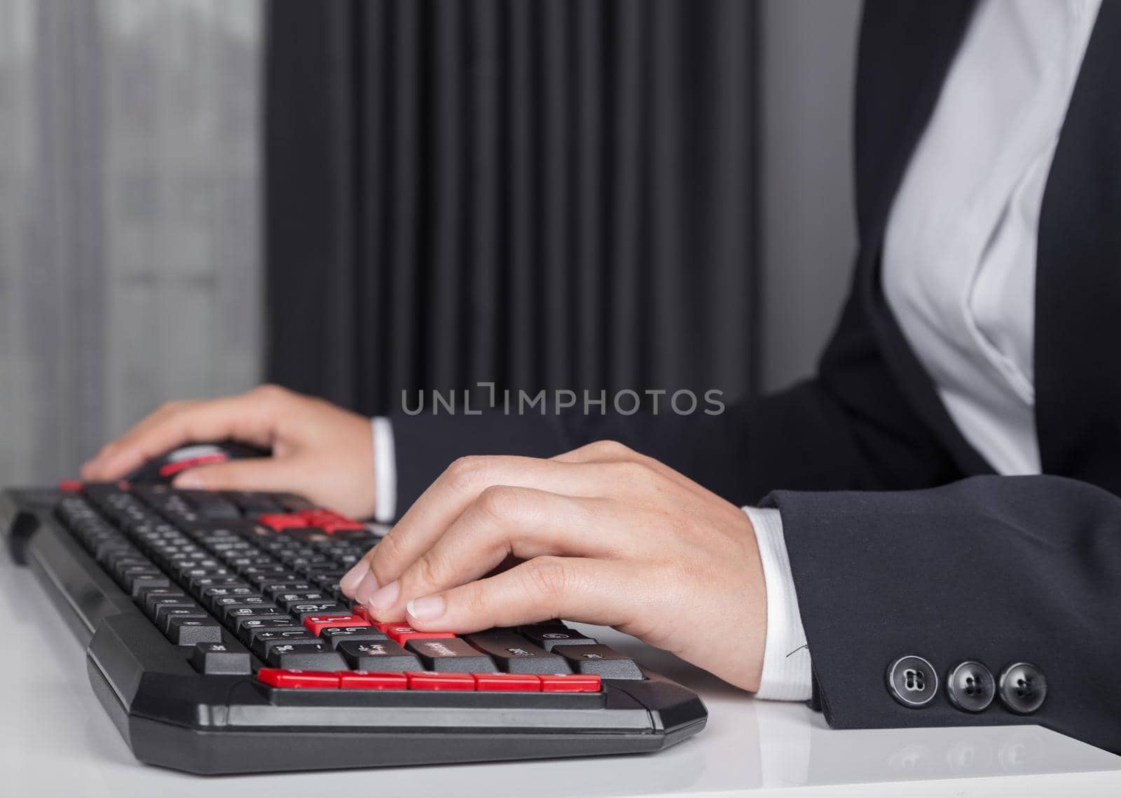 business hands working on computer keyboard and mouse