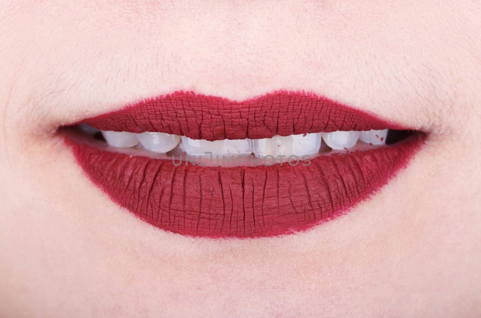 womans lips with red glossy lipstick by geargodz