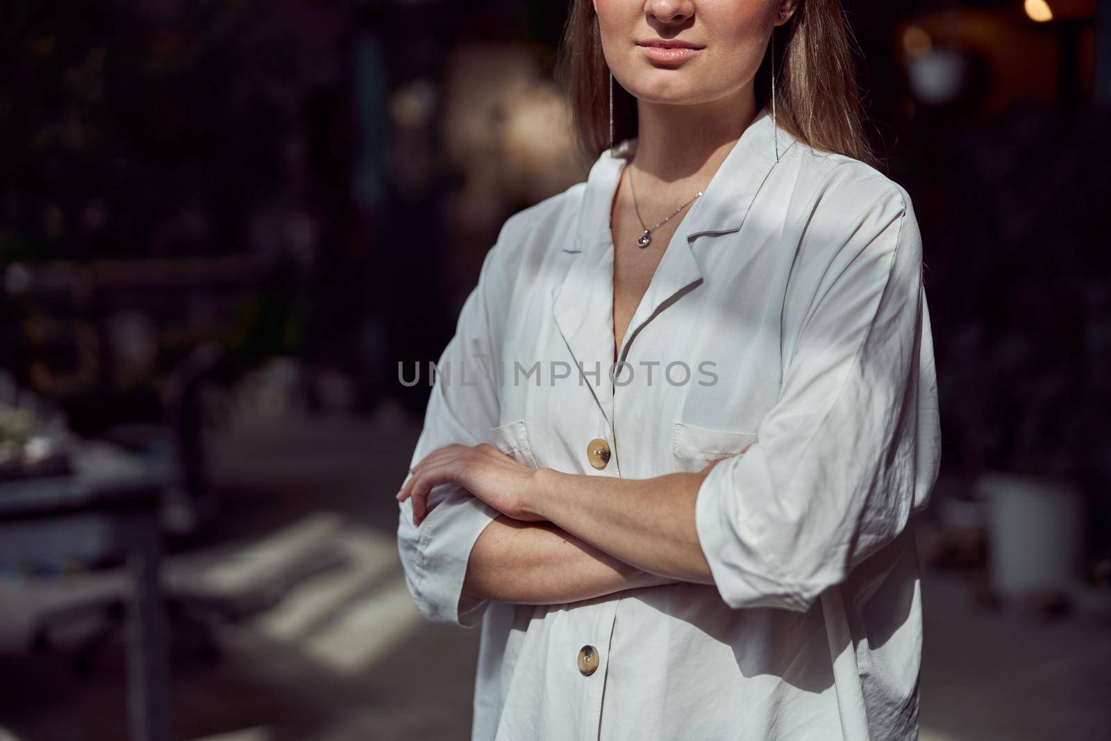 Young caucasian happy seller woman at botanic shop by Yaroslav_astakhov