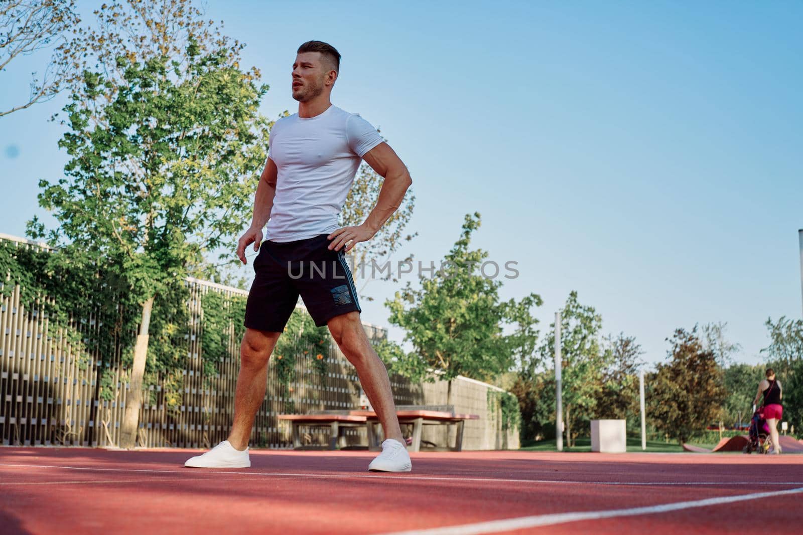 man doing exercises outdoors on the playground. High quality photo