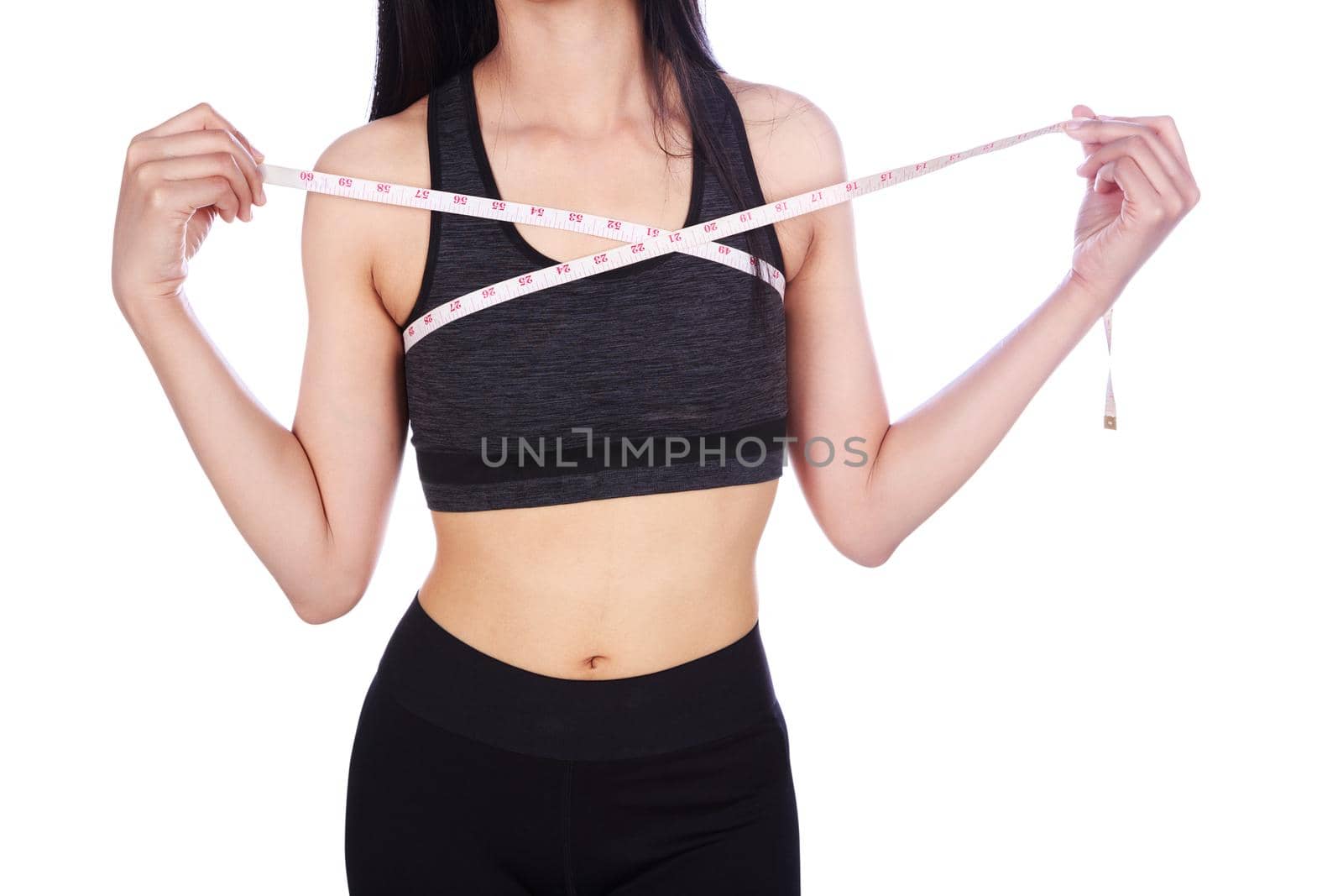 clsoe up woman is measuring her chest with measure tape isolated on white background (diet concept)