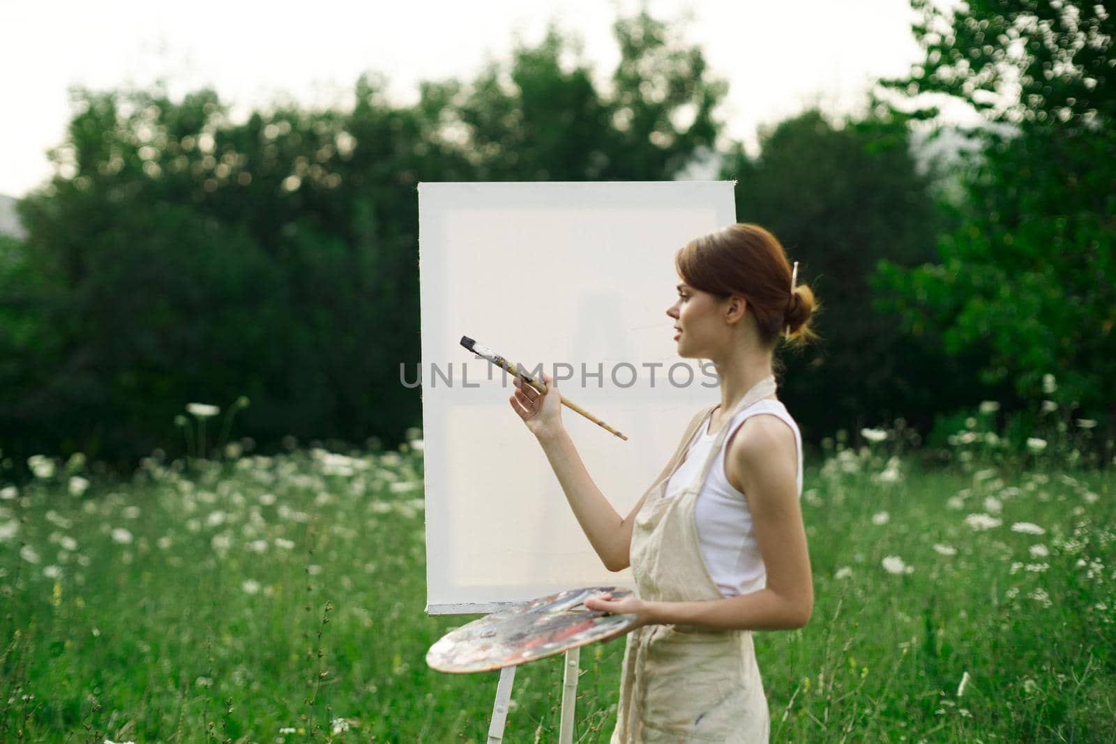 woman artist outdoors easel drawing creative landscape by Vichizh