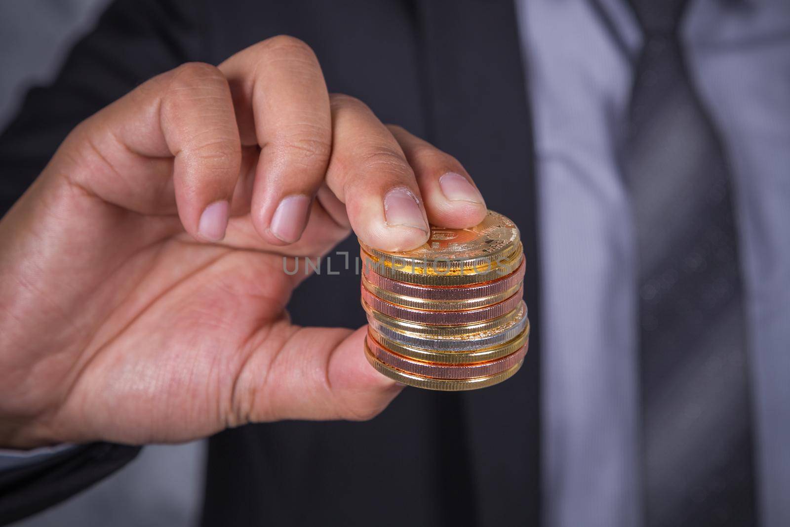 bitcoin in hand of business man with suit