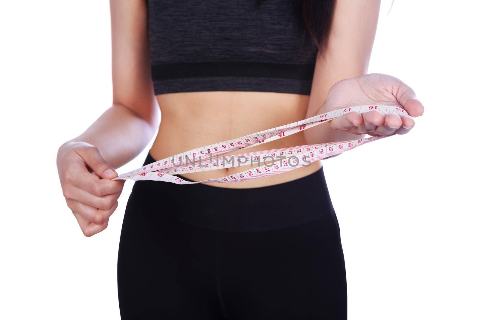 close up fitness woman holing measure tape isolated on white backgrond (diet concept)