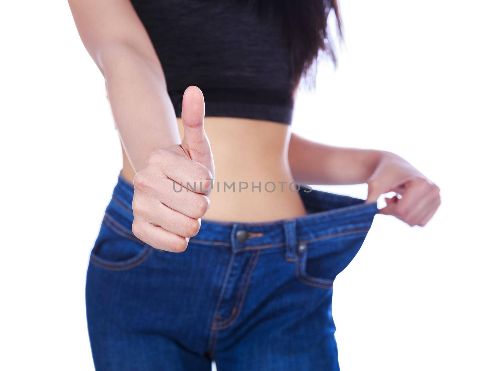 close up slim woman in old jeans showing thumbs up isolated on white background by geargodz
