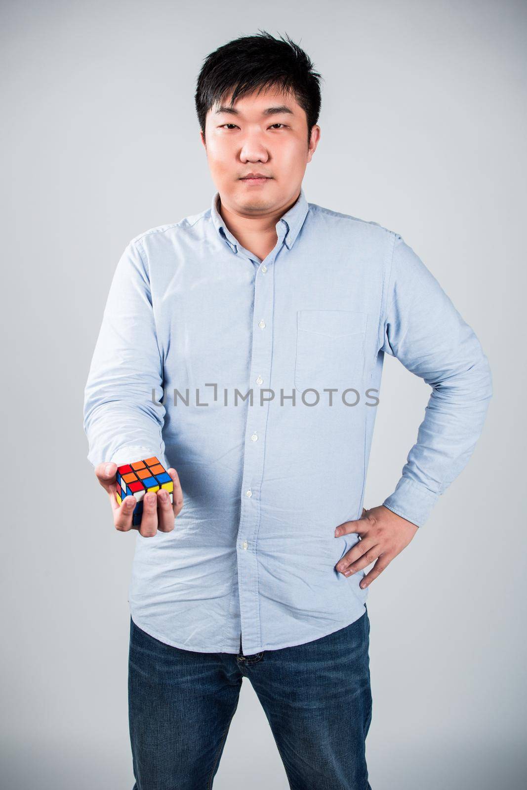 man play a rubik's cube at home by whatwolf