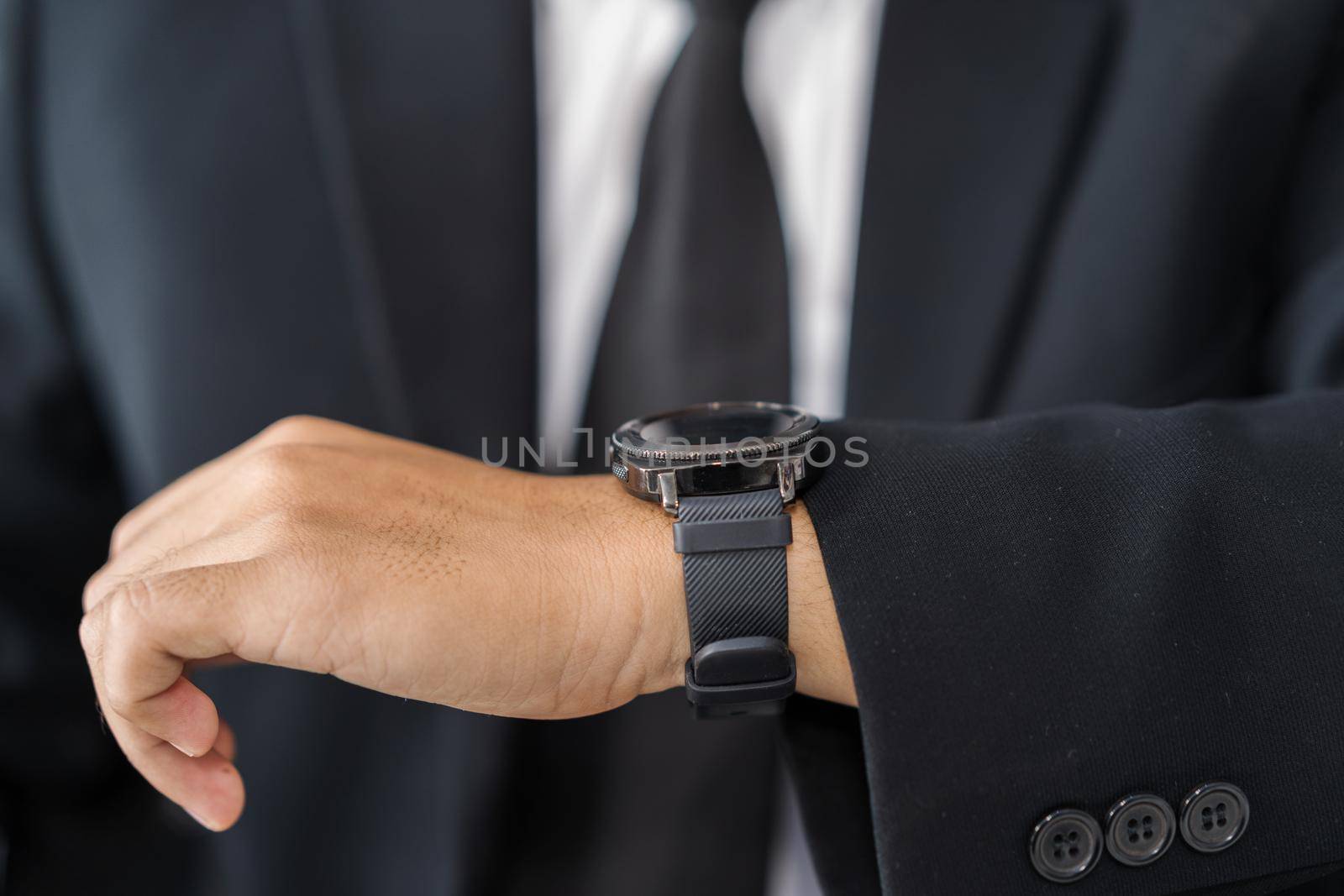 close up hand of business man with smart watch