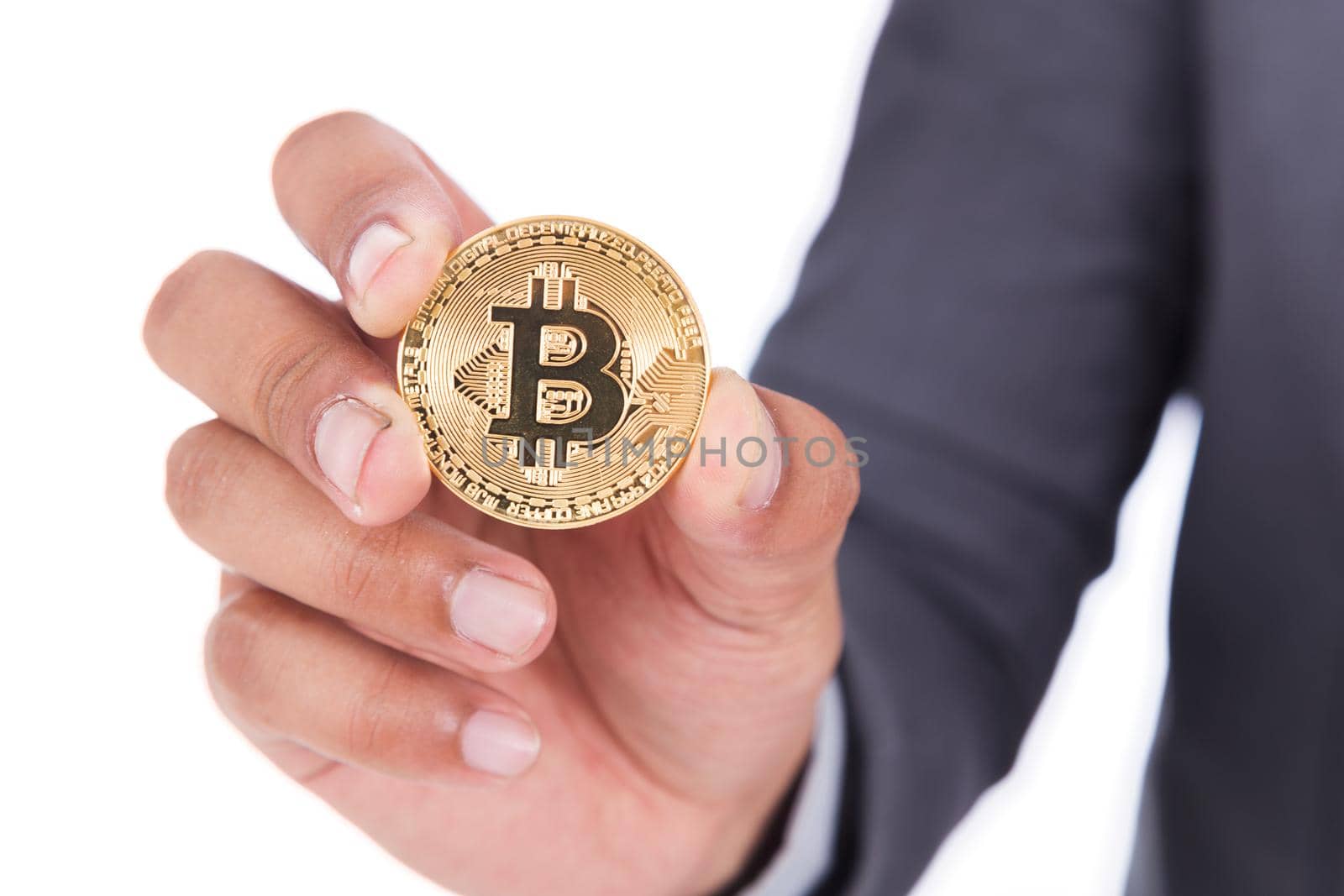bitcoin in hand of business man with suit isolated on white background