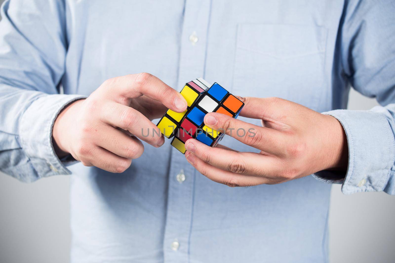 man play a rubik's cube at home by whatwolf