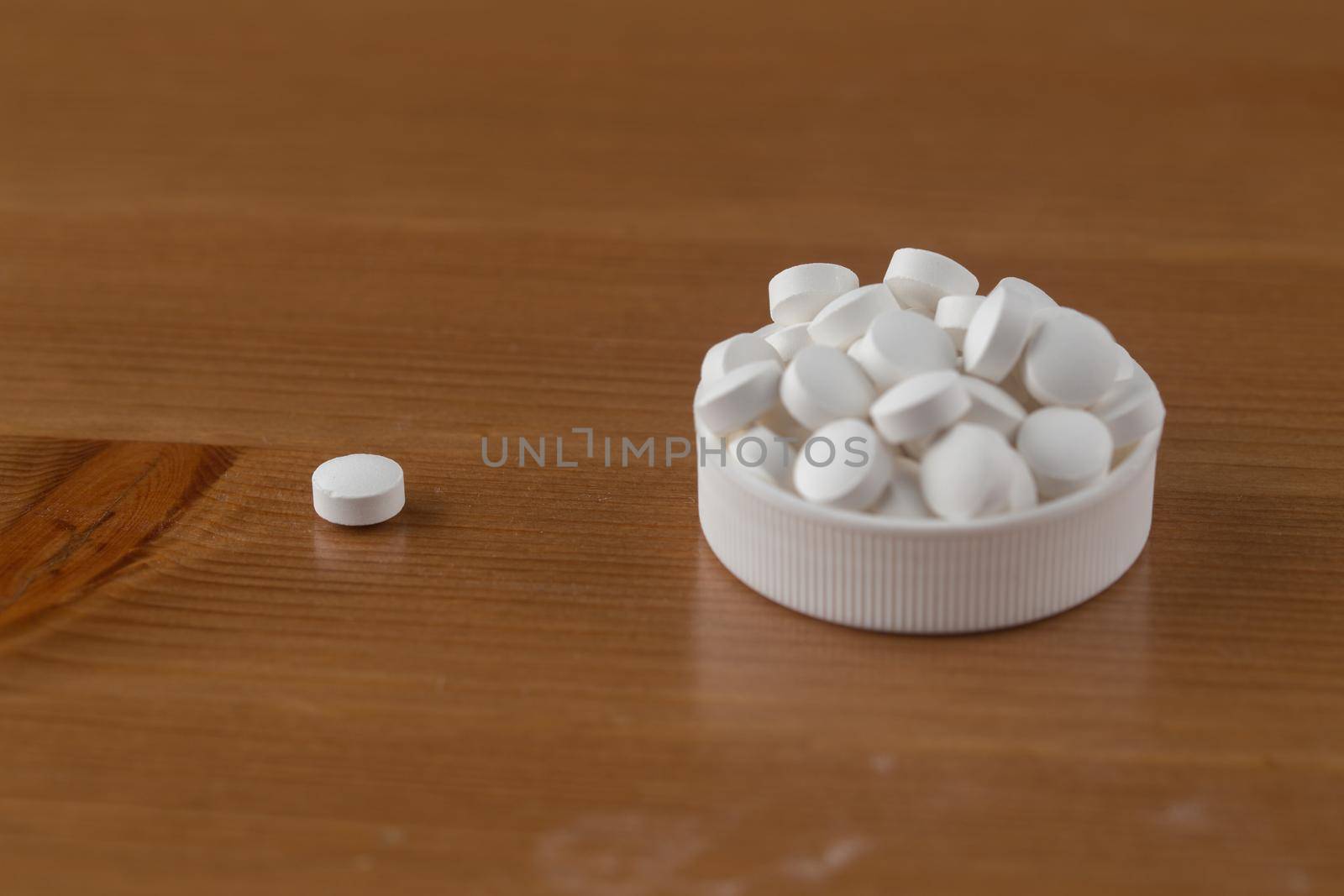 Close up of white pills.