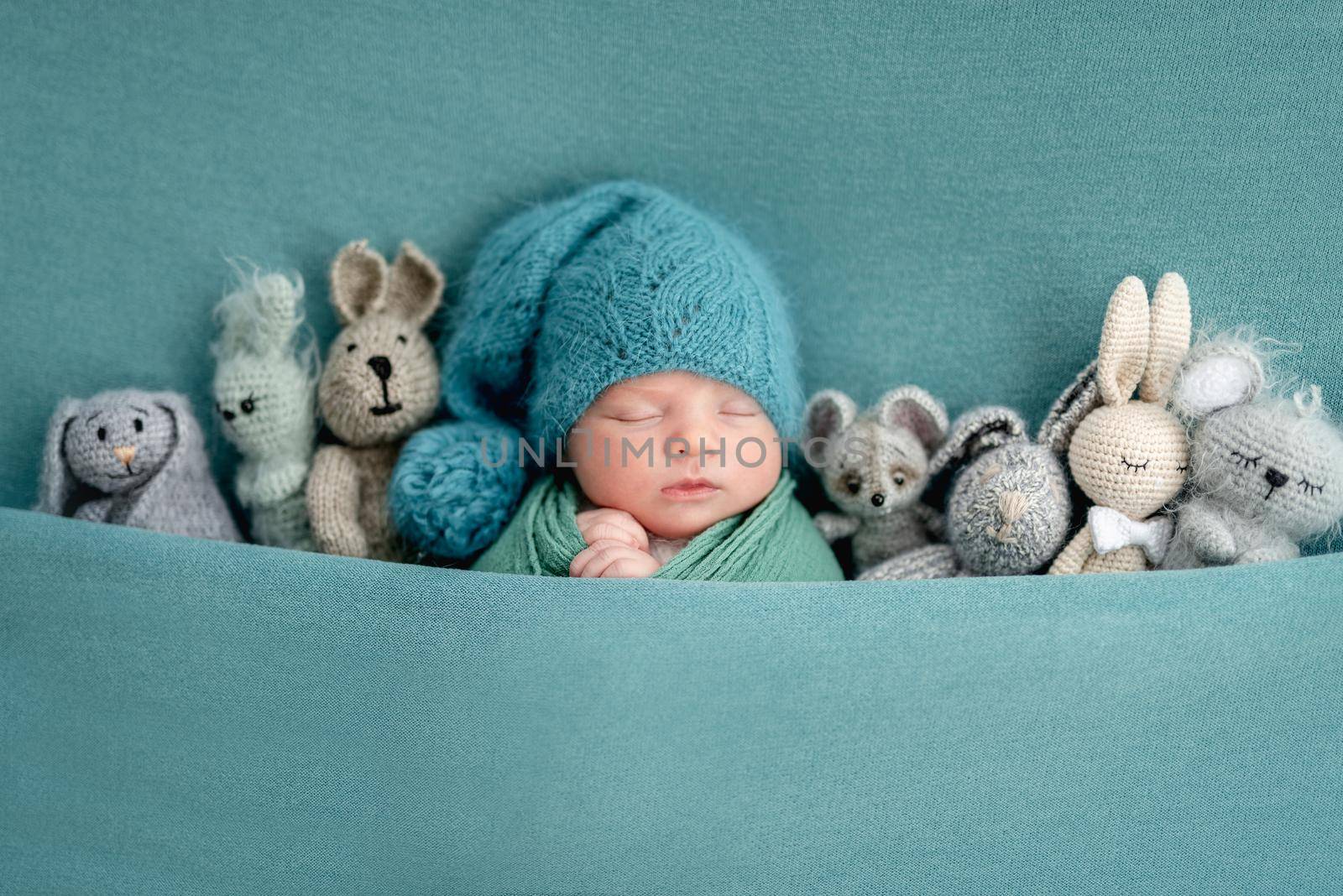 Beautiful newborn with knitted toys by tan4ikk1