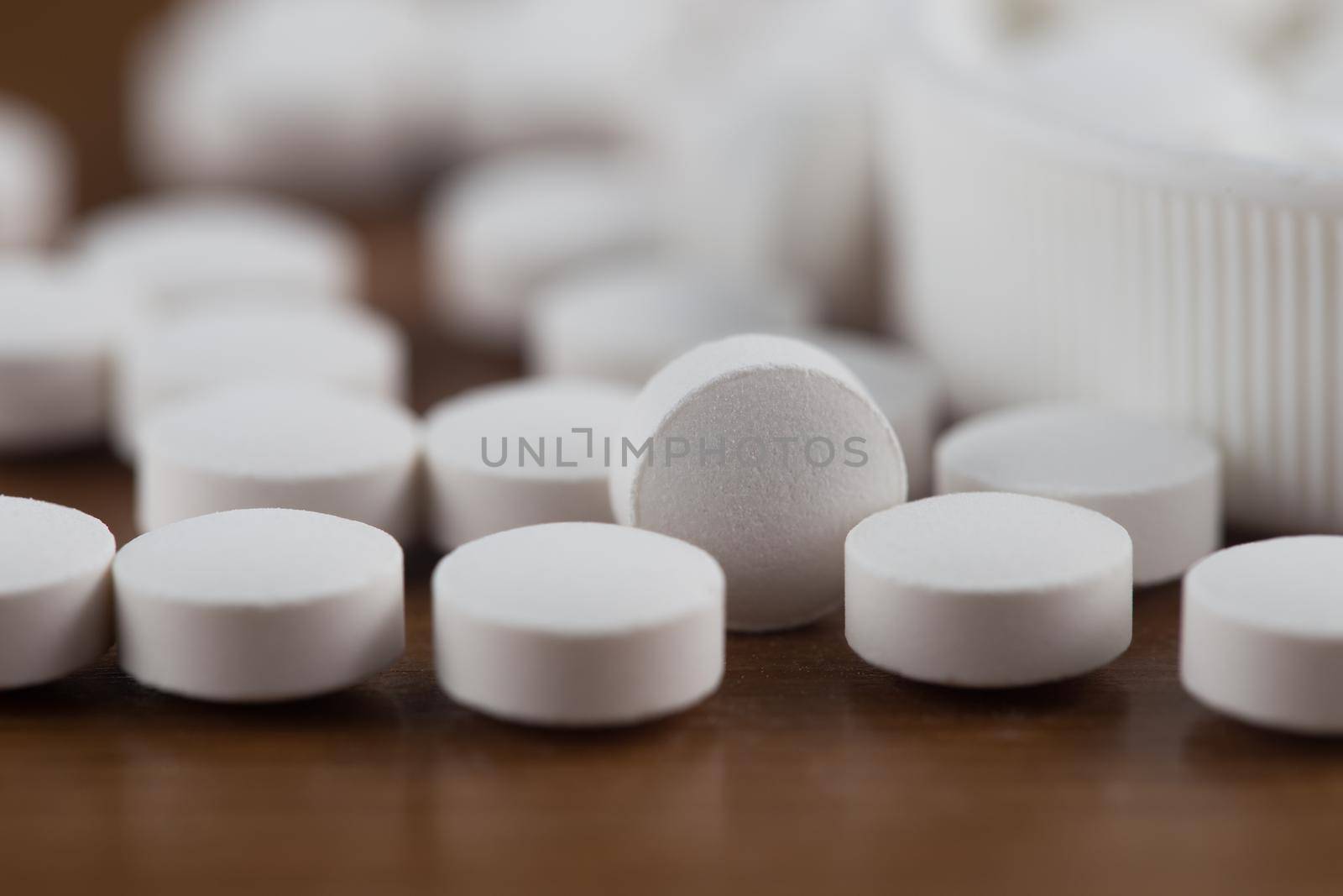 Close up of white pills.