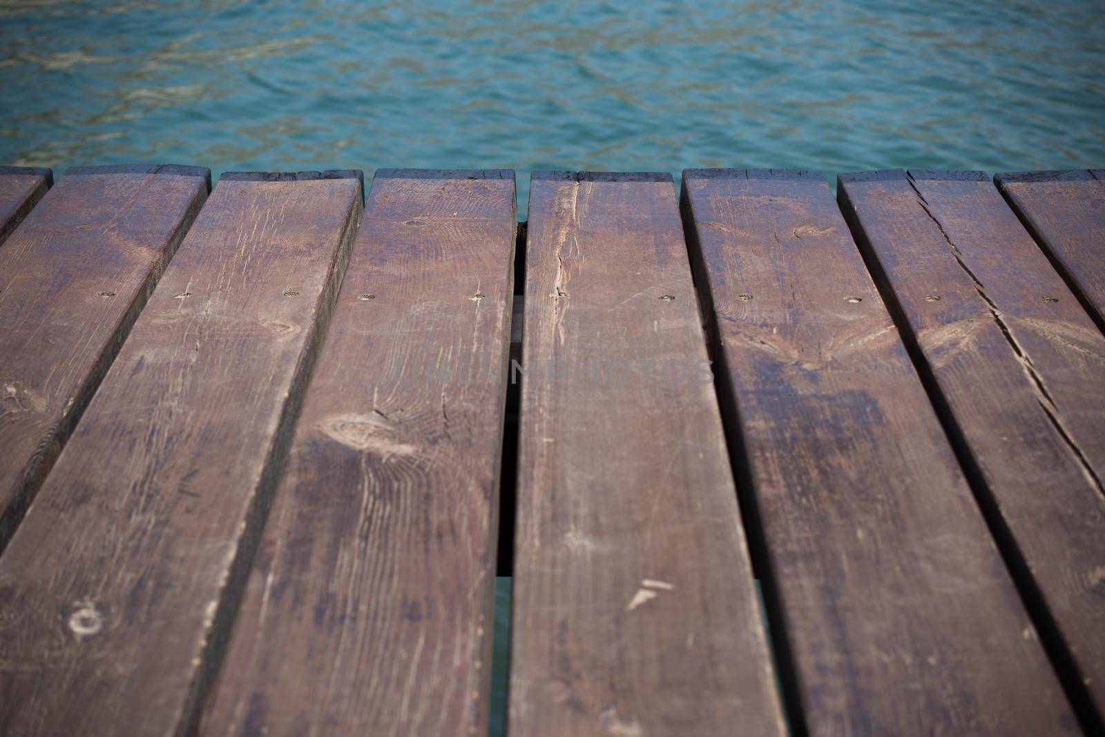 Empty wooden jetty on the lake shore