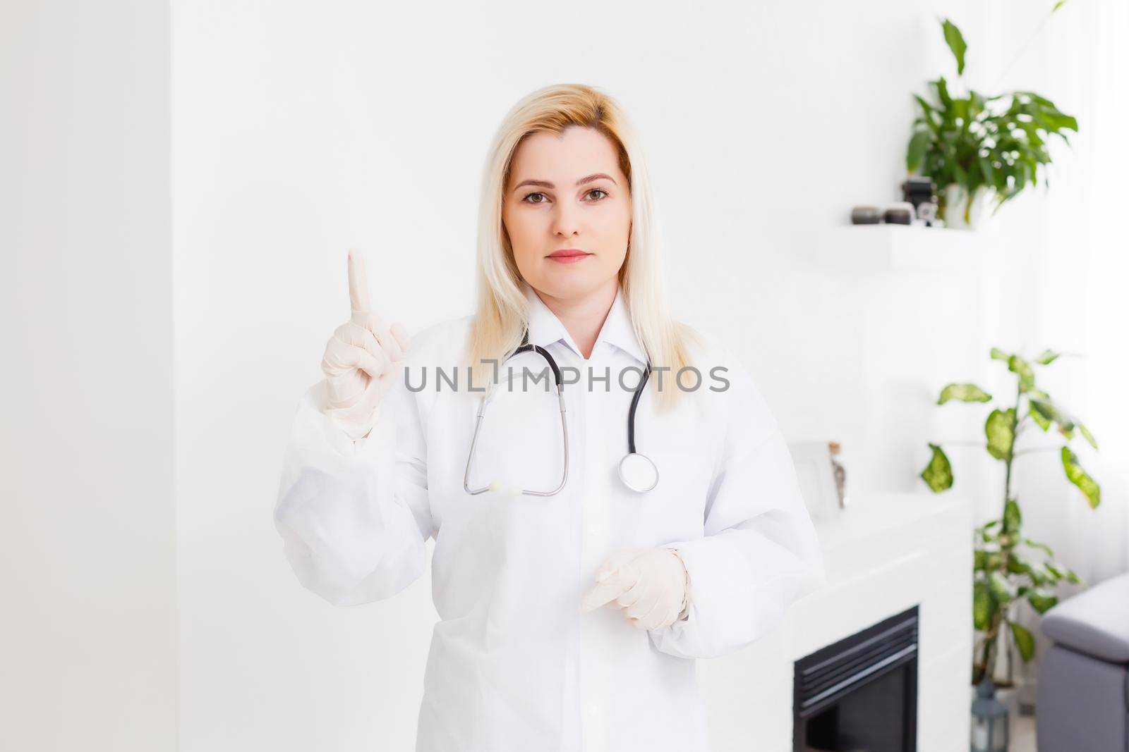 Portrait of a beautiful happy female doctor standing in the hospital