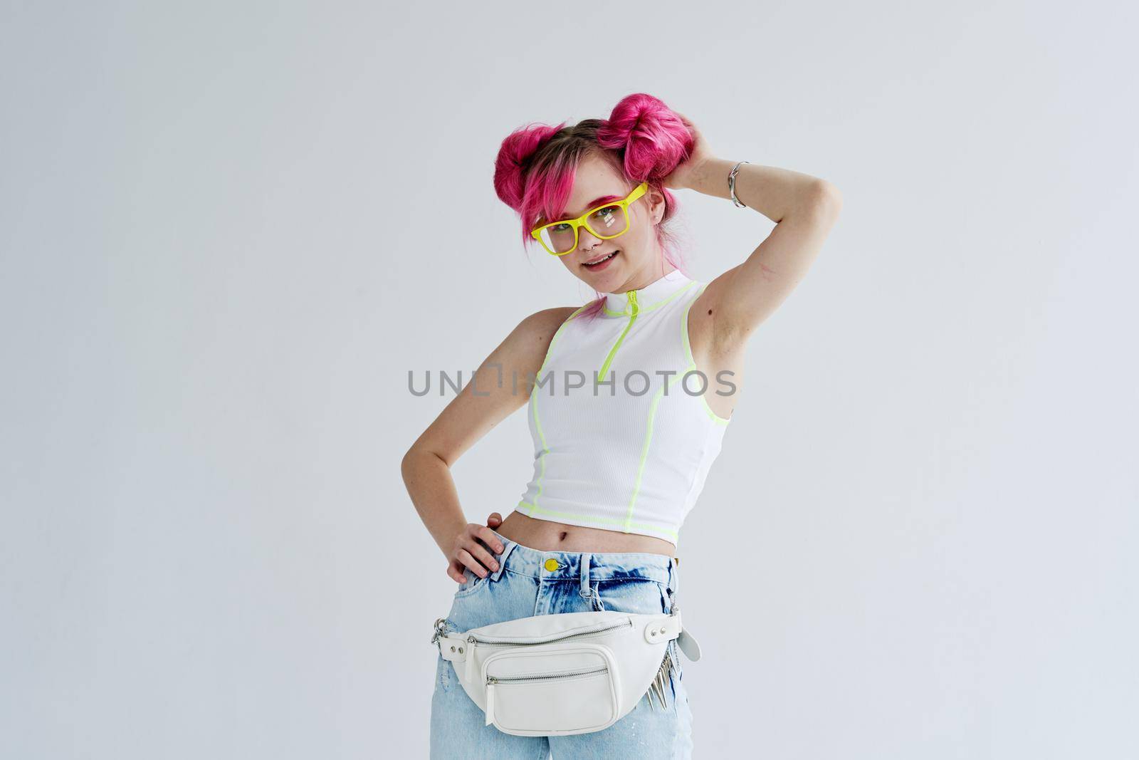 fashionable woman pink hair posing fashion clothes studio model. High quality photo