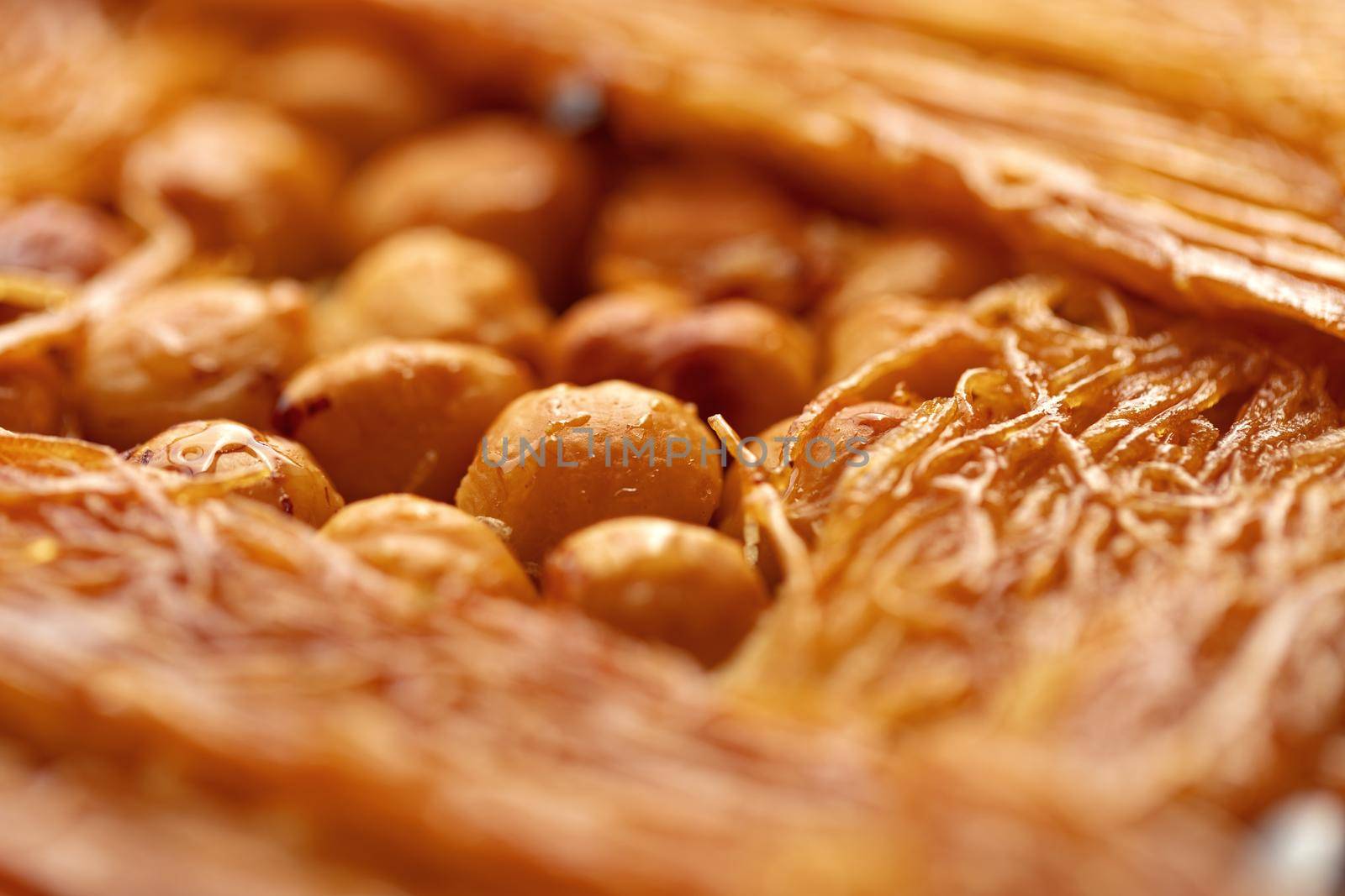 Close up photo of Turkish Baklava dessert with honey and nuts