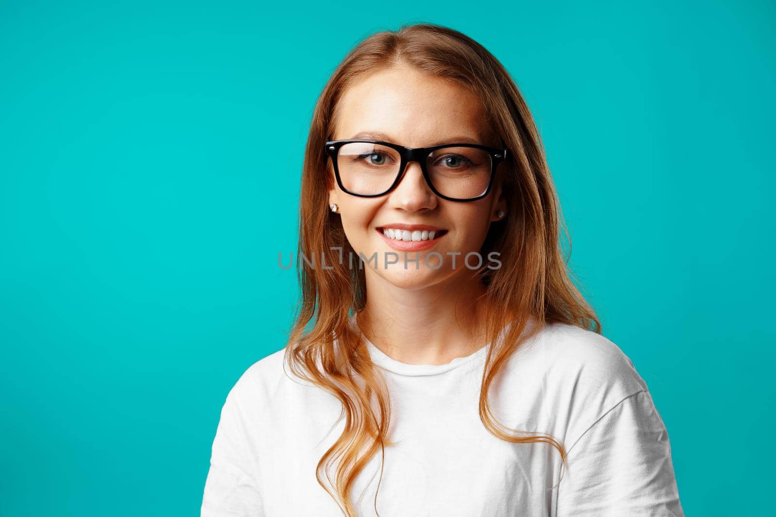 Portrait of a young attractive caucasian woman in glasses close up