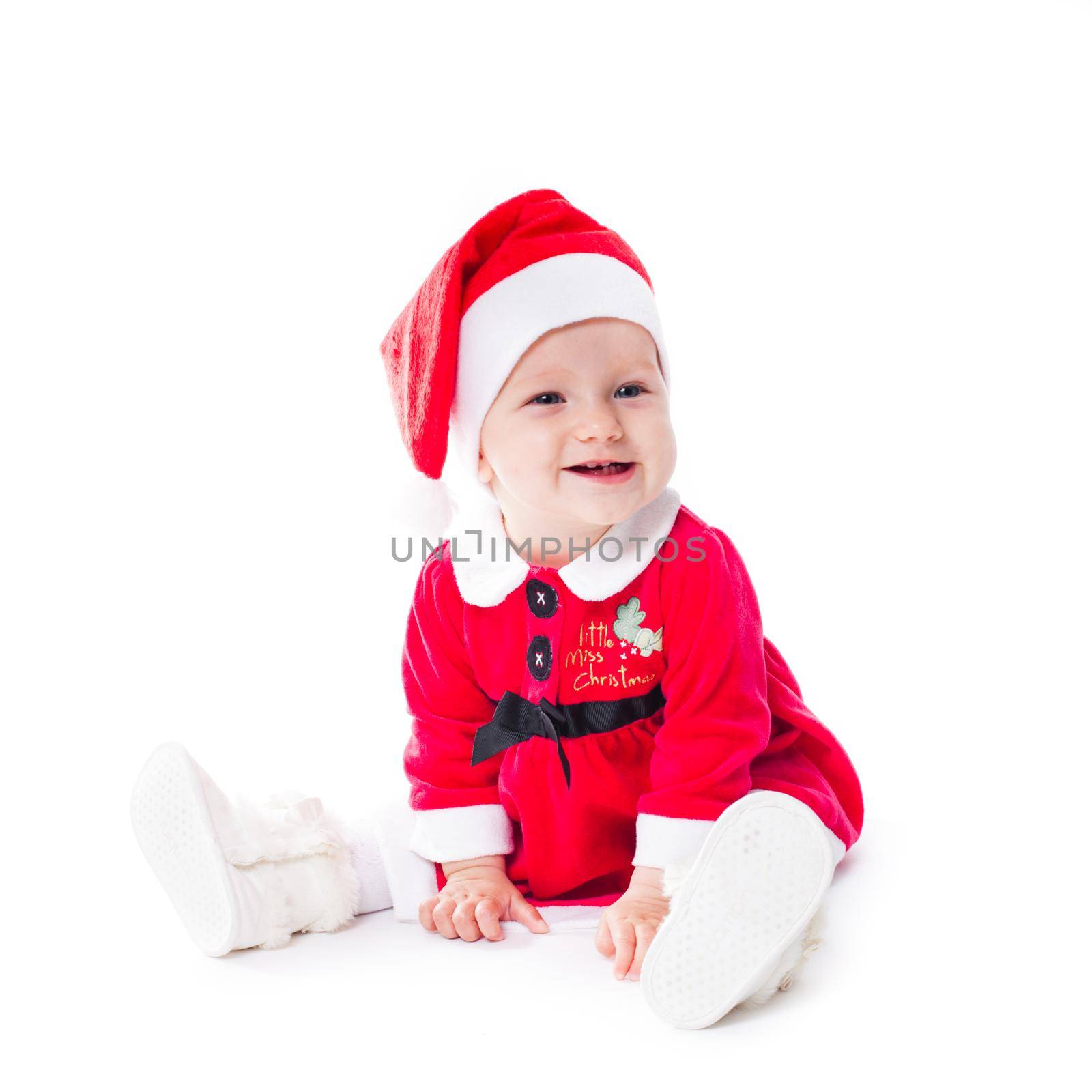 Santa baby girl in christmas dress isolated on white