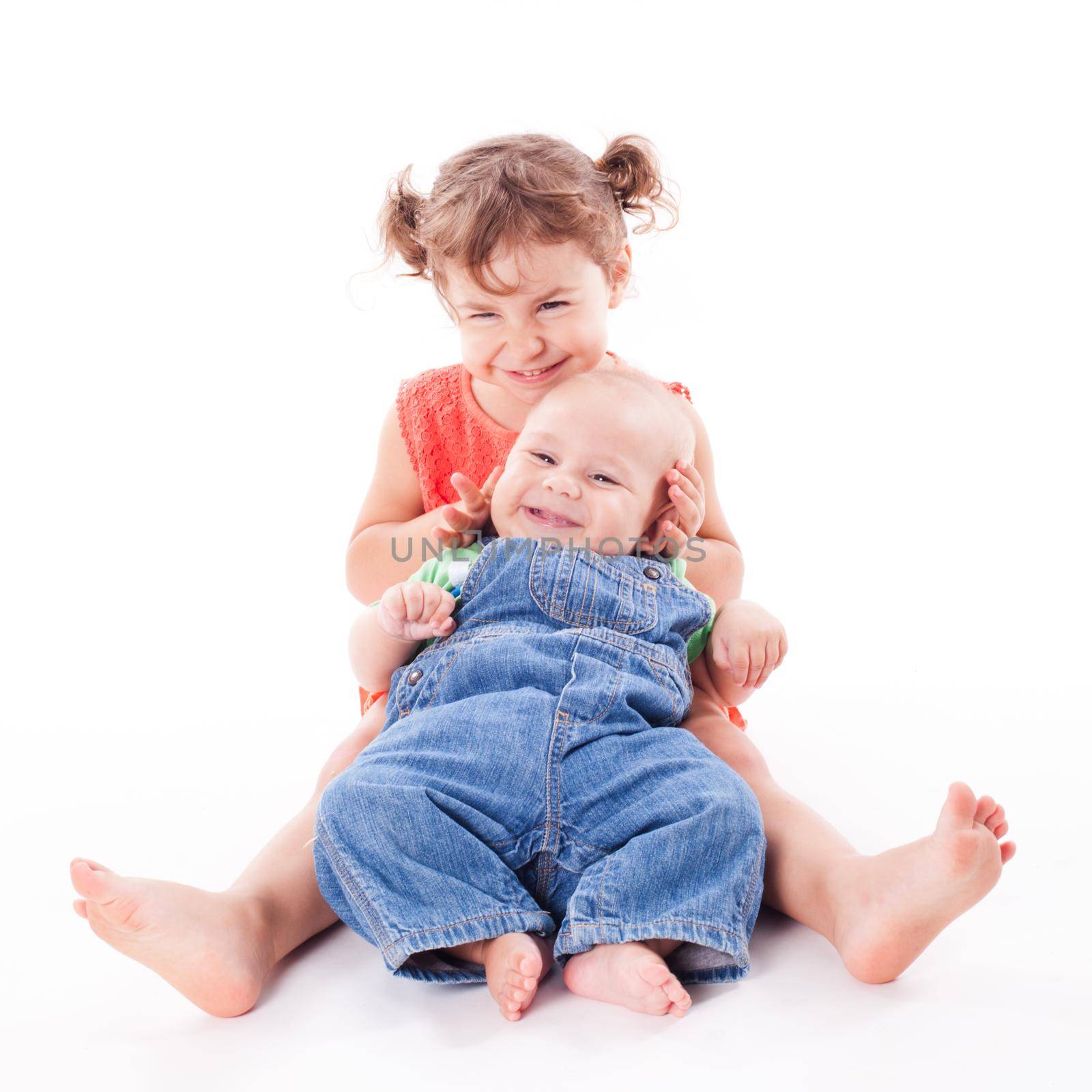 Adorable family. Sister and brother isolated on white