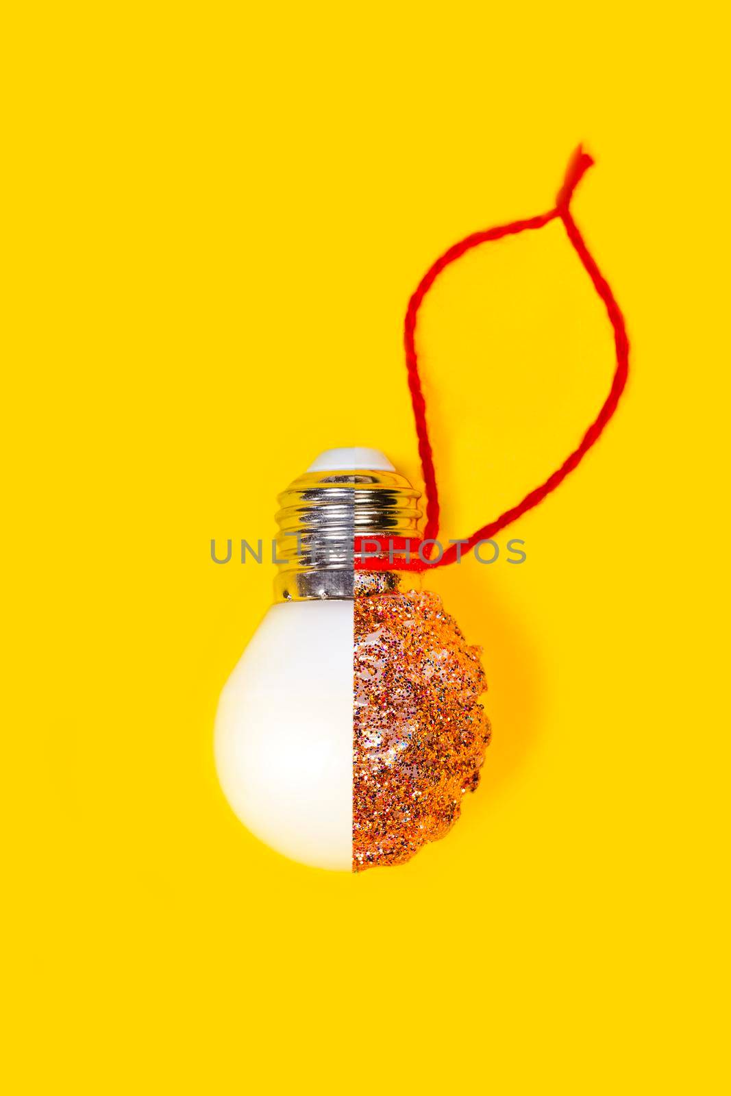 Reuse concept. New year or Christmas DIY decoration made from LED lamps and glitter