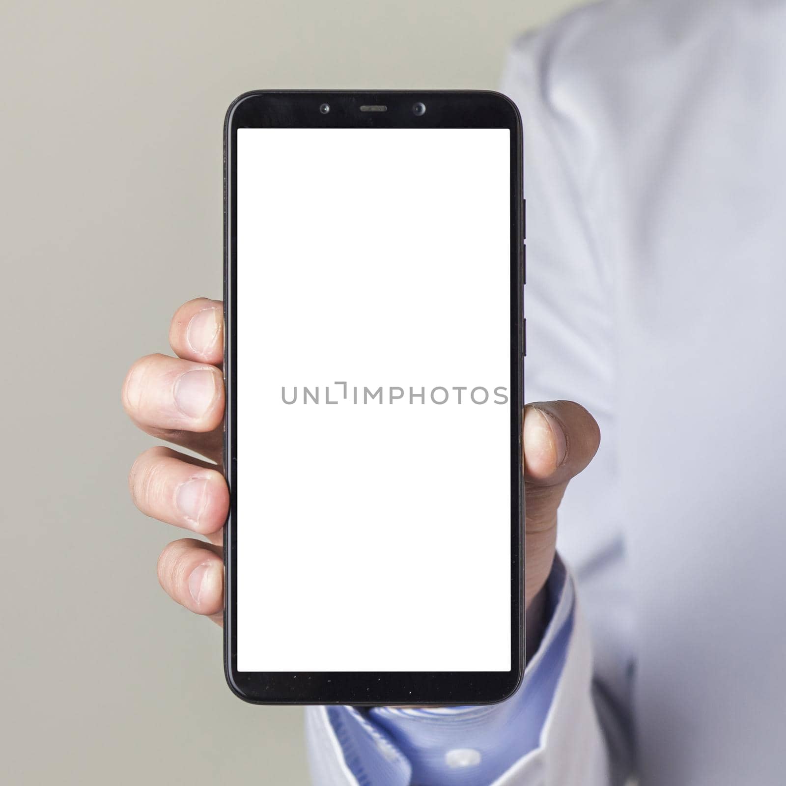 close up male doctor s hand showing smartphone with white screen display by Zahard