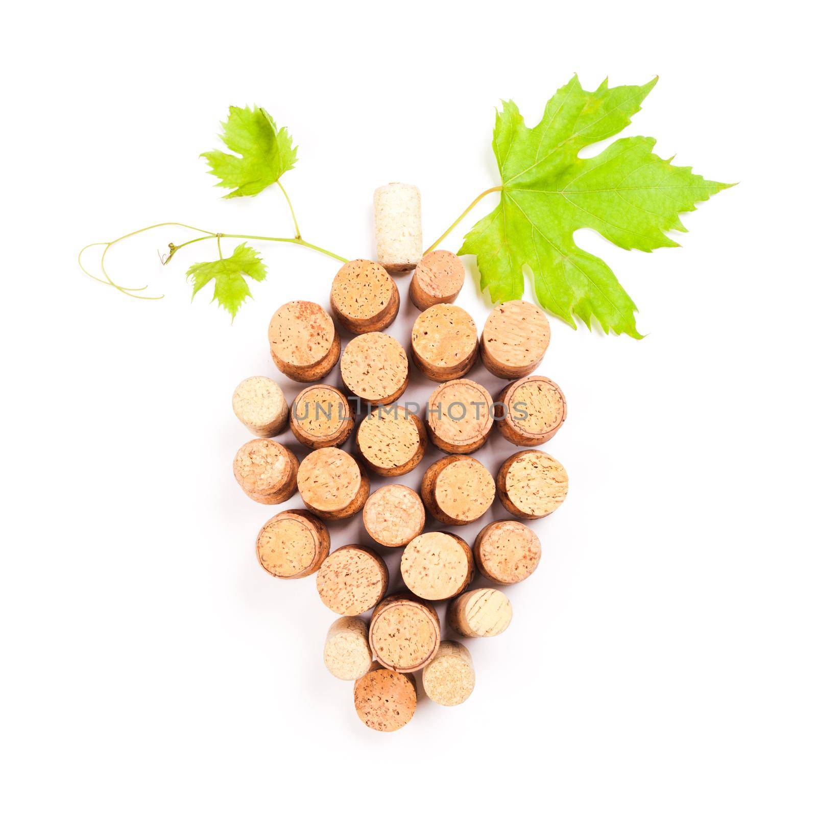 Wine corks isolated on white in grape shape with green leaf