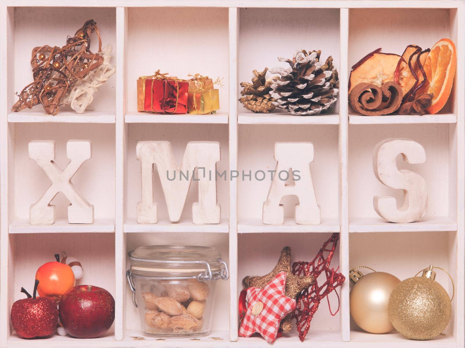 Christmas decoration in a wooden box. Cozy holiday in home. Wood letters XMAS in shadow box memories