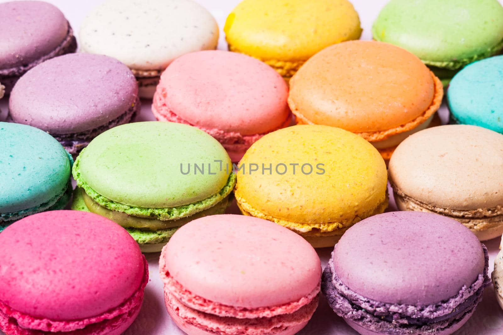 Colorful macaroons - french dessert as a background