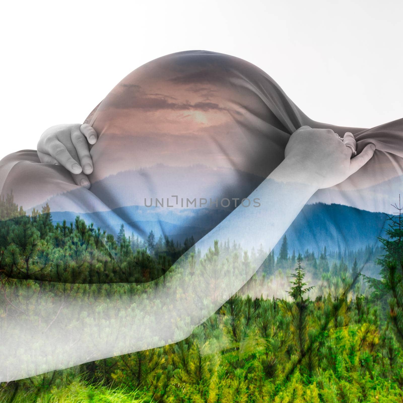 Double exposure pregnant woman and mountain landscape on the sunset