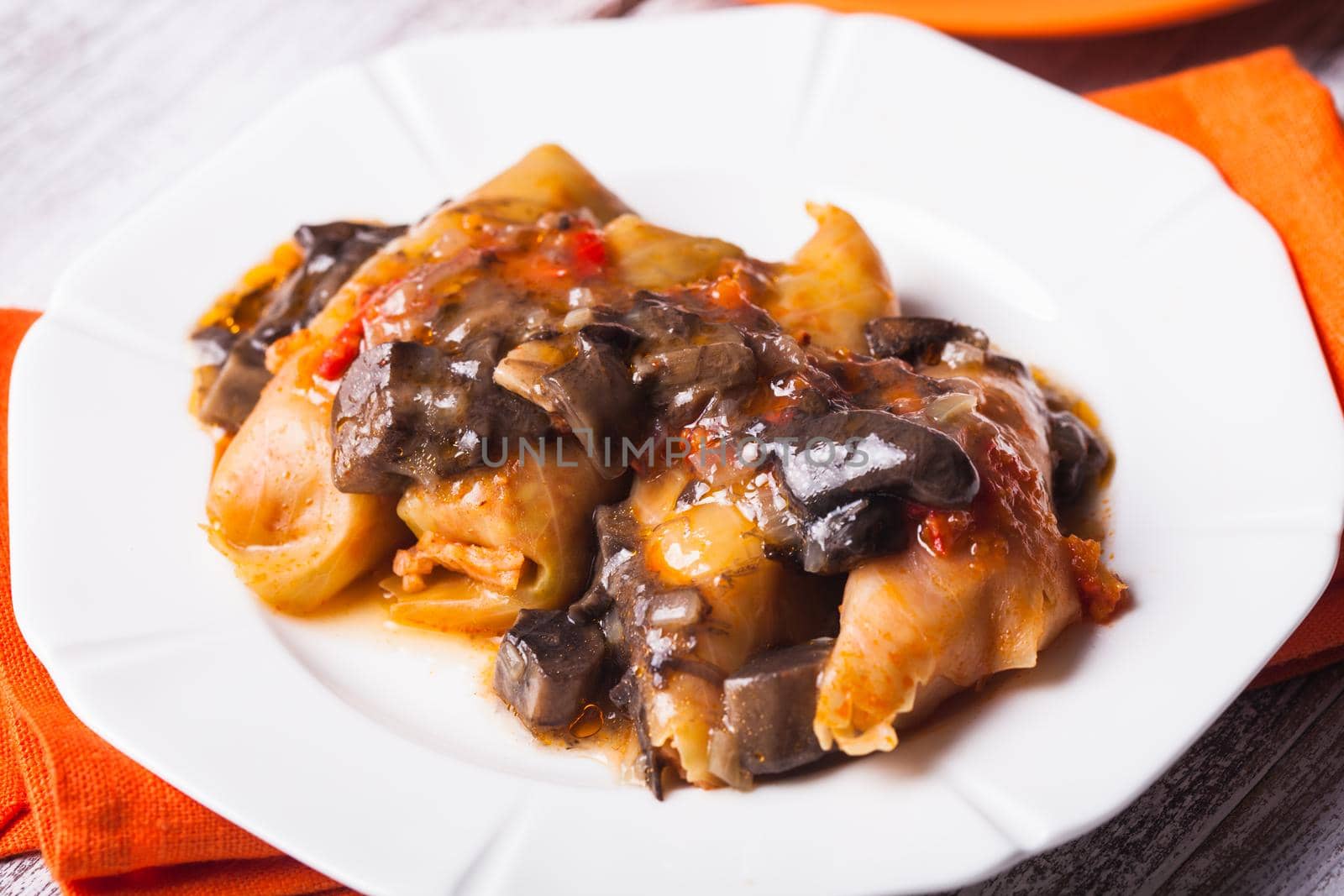 Stuffed cabbage with mushroom sauce on a plate