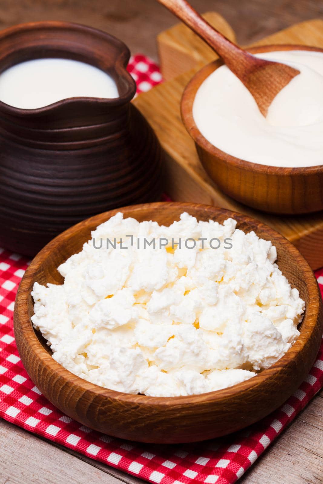 Sour cream and curd on a wooden rustic board