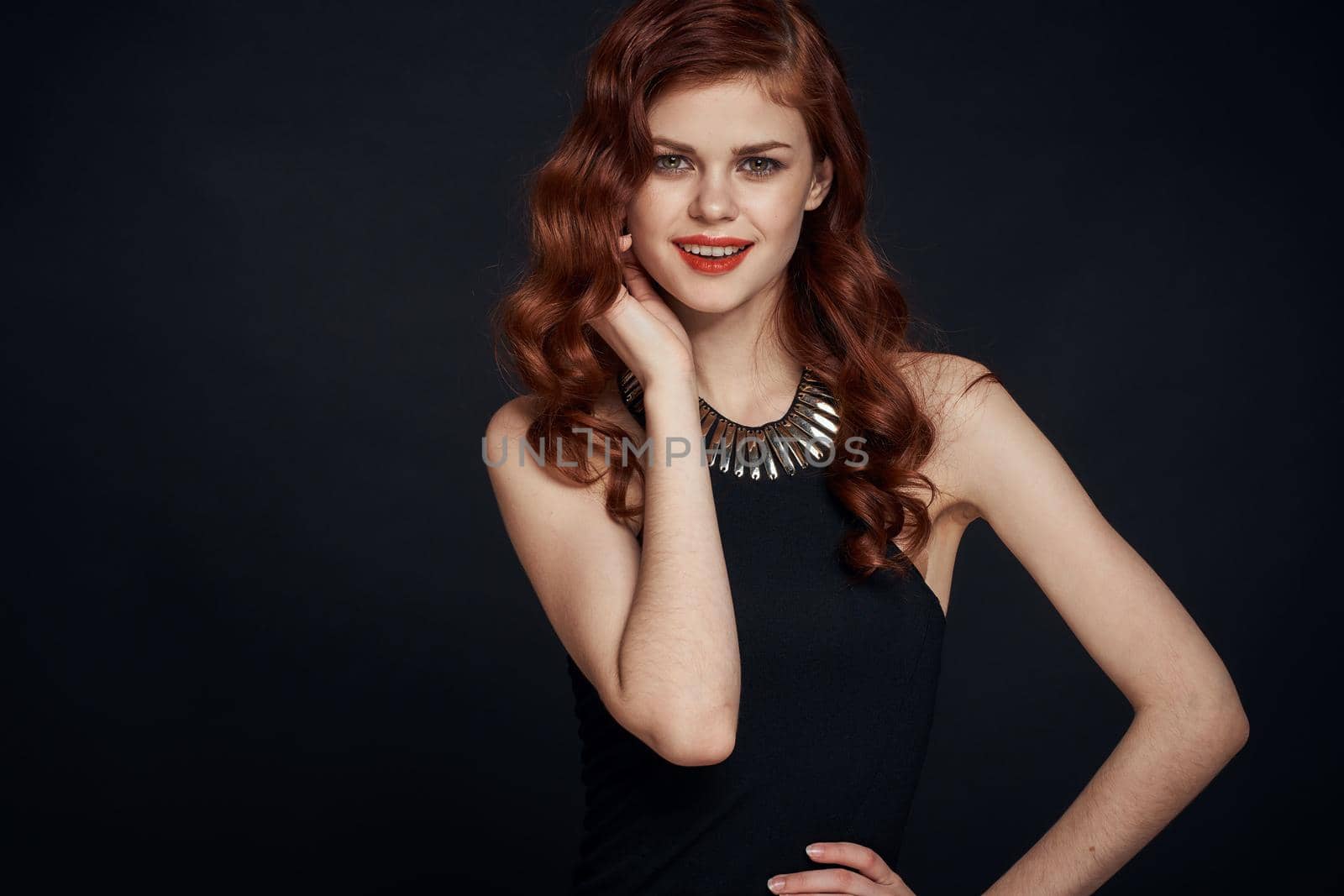 woman in black dress attractive look glamor posing charm. High quality photo