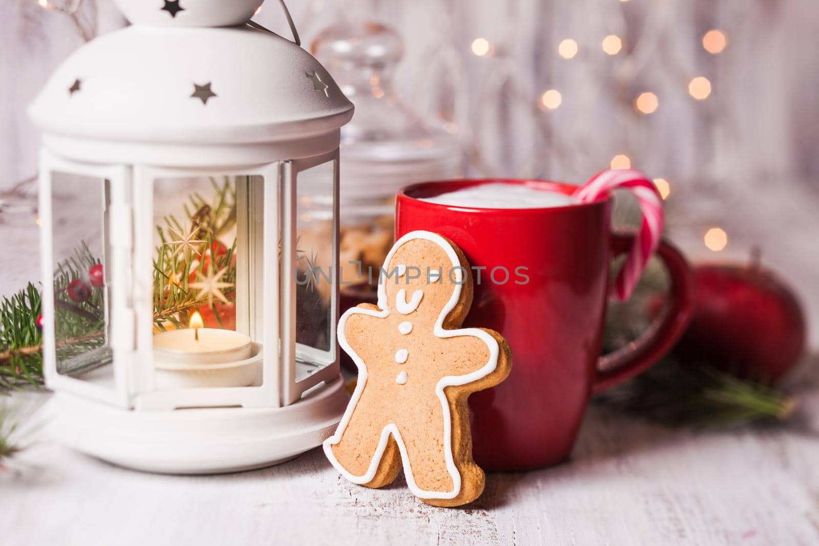 Cup of hot cocoa drink with cookie and candy. Christmas dessert