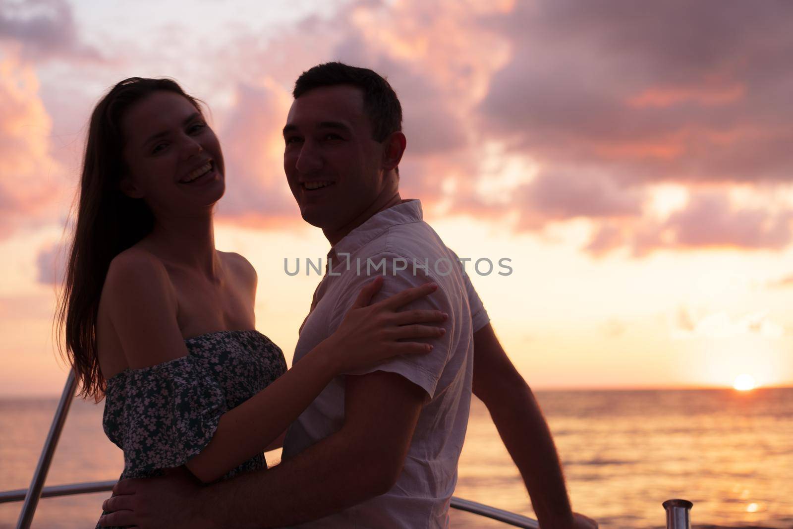 Romantic sensual young couple in love at the sunset by Fabrikasimf