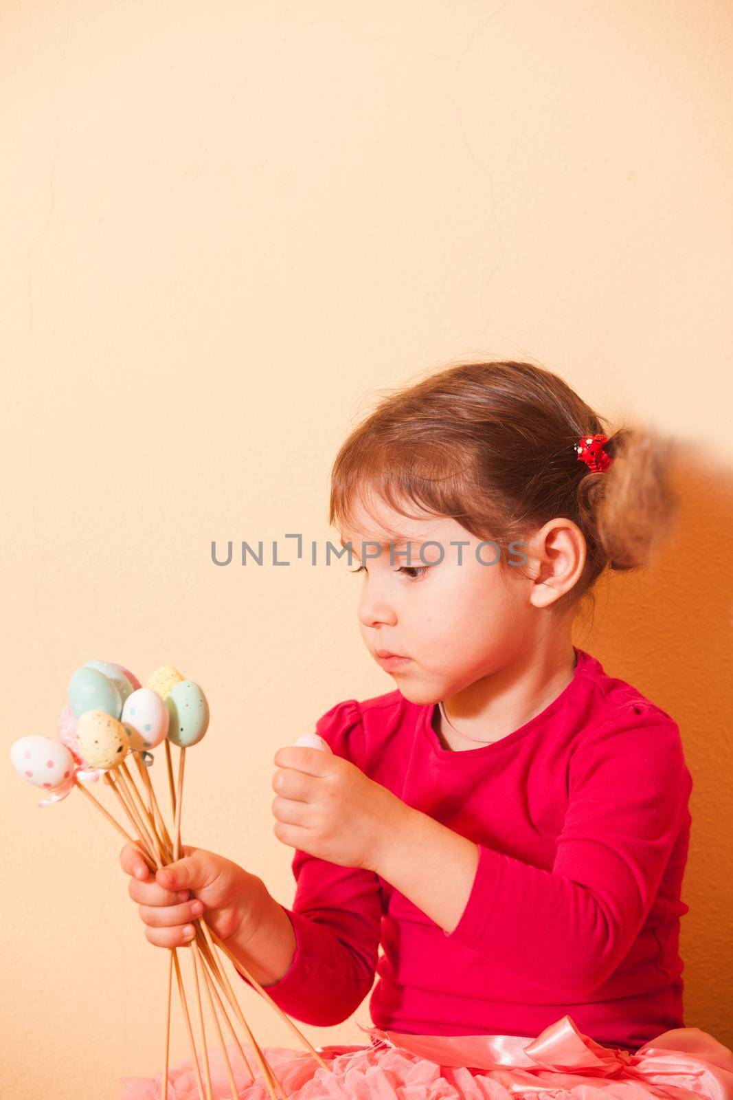 Girl is doing an Easter handmade decorations for holiday