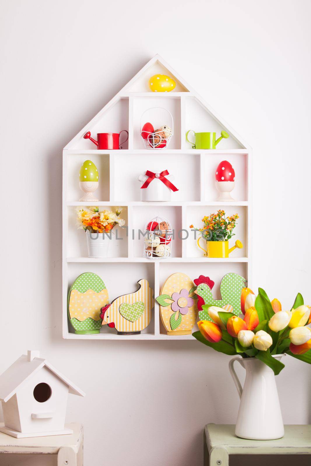 House shelves on a wall - Easter decorations for holiday