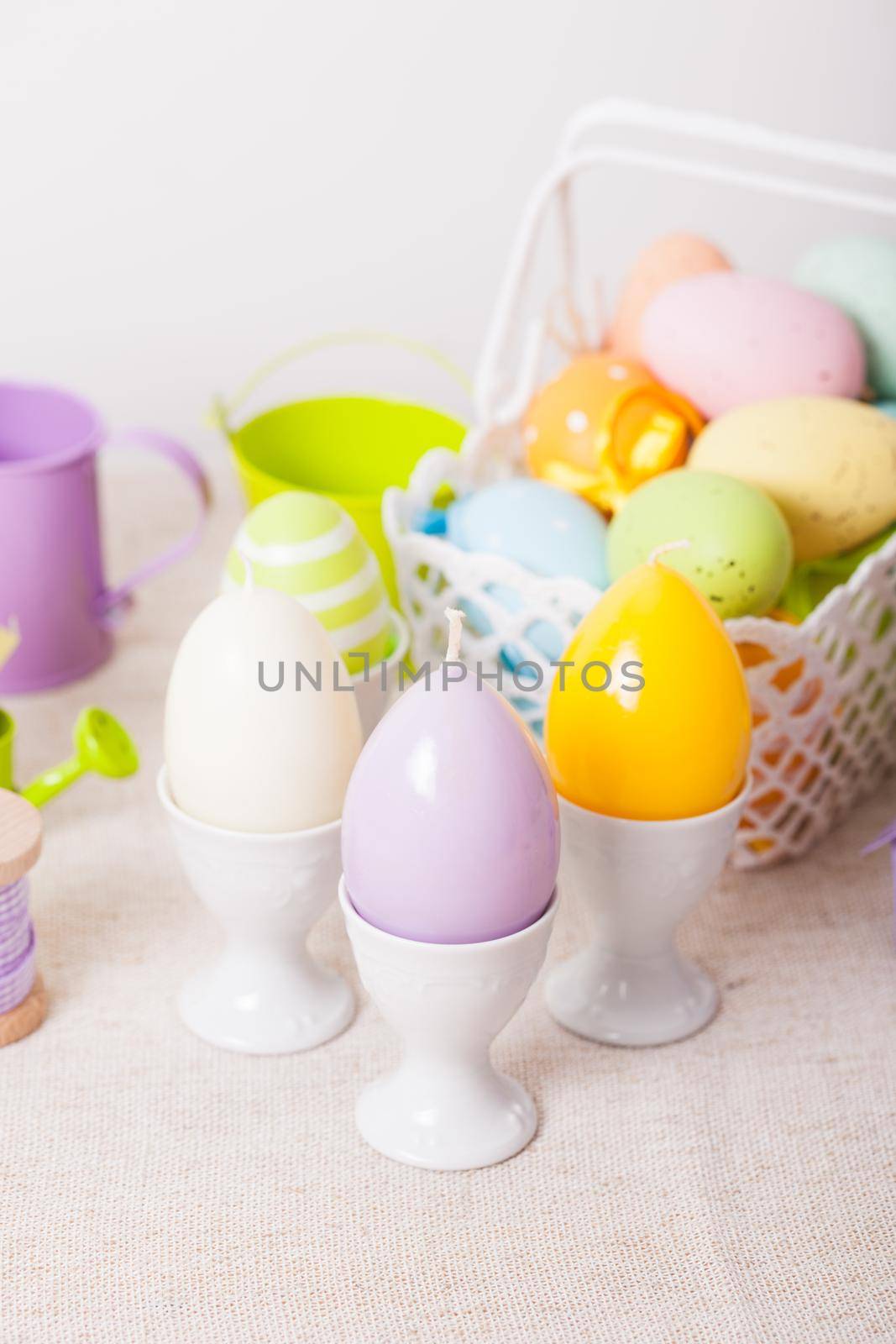 Easter decorations - egg candles, basket and birdhouse