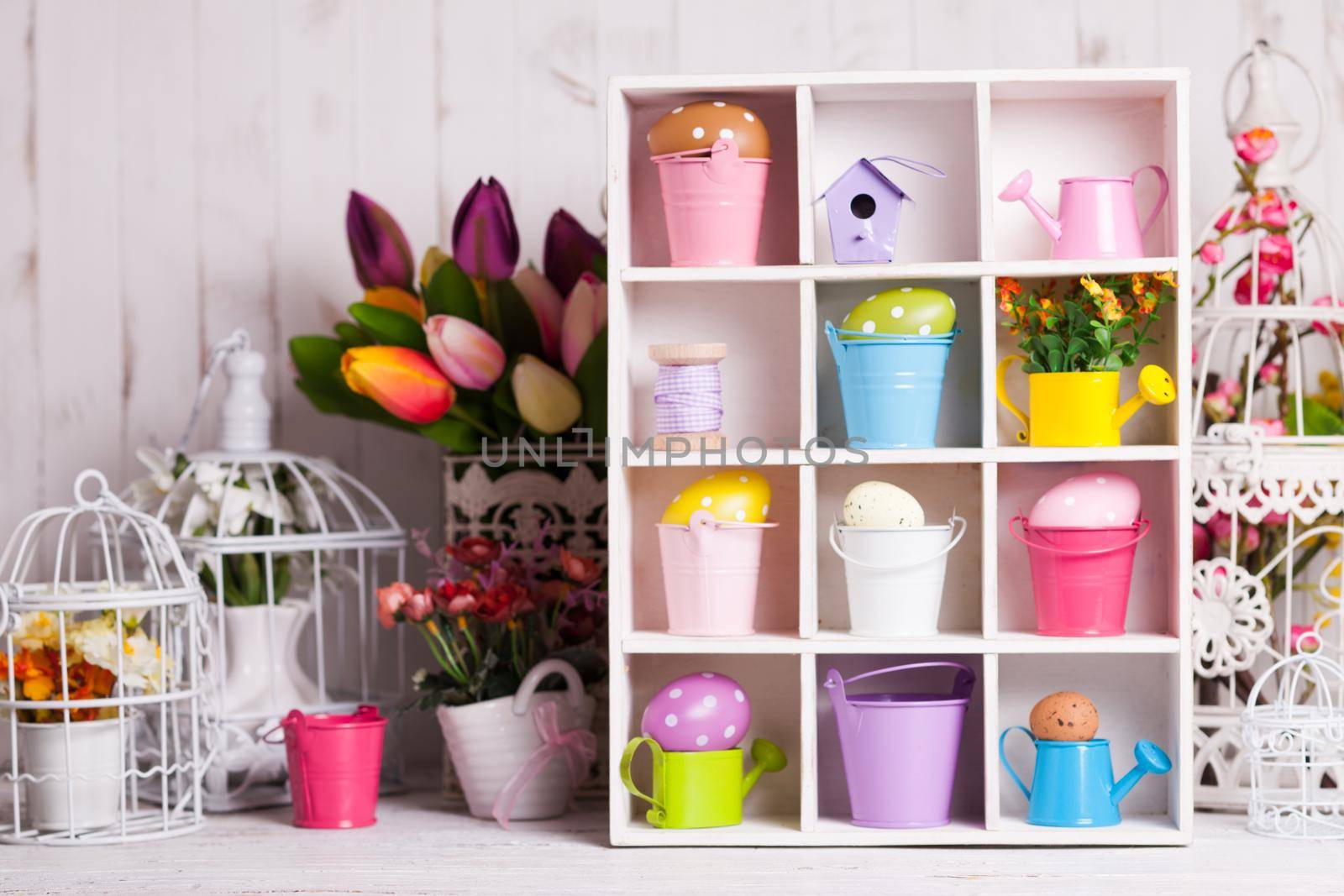 Colourful Eggs in miniature buckets and cans in shadowbox. Spring and Easter decor