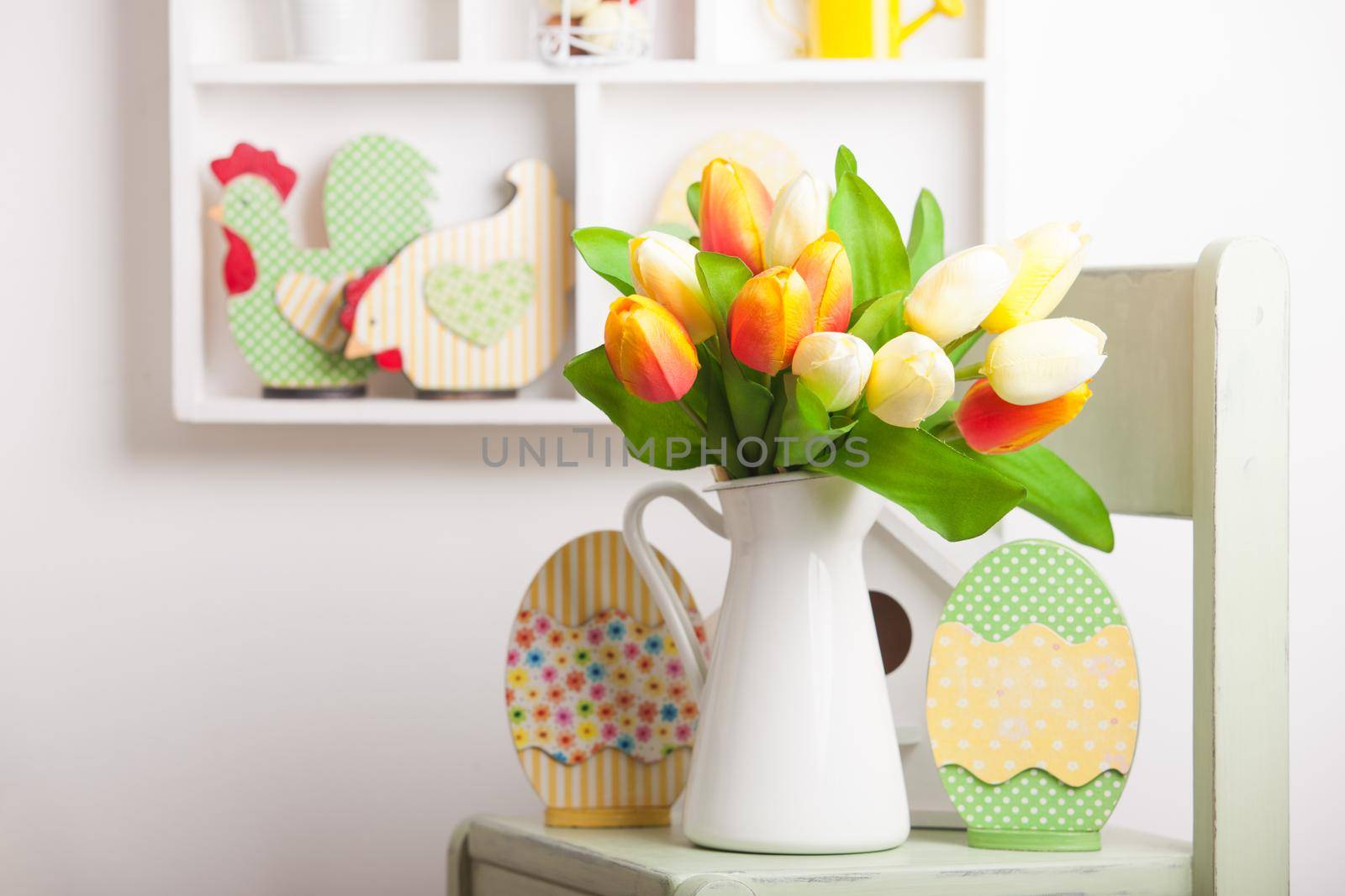 House shelves on a wall - Easter decorations for holiday