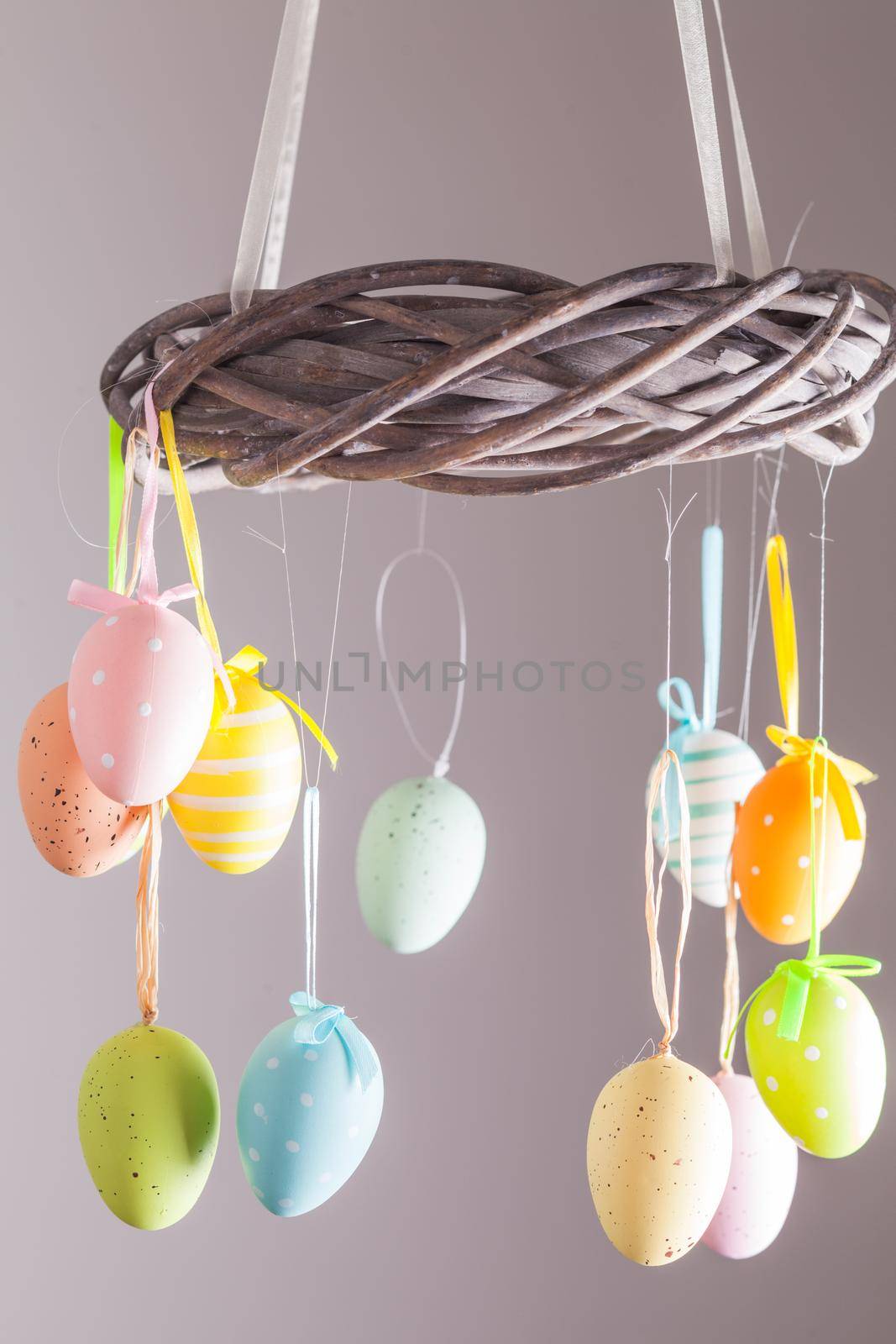 Easter wreath with color eggs on ribbons