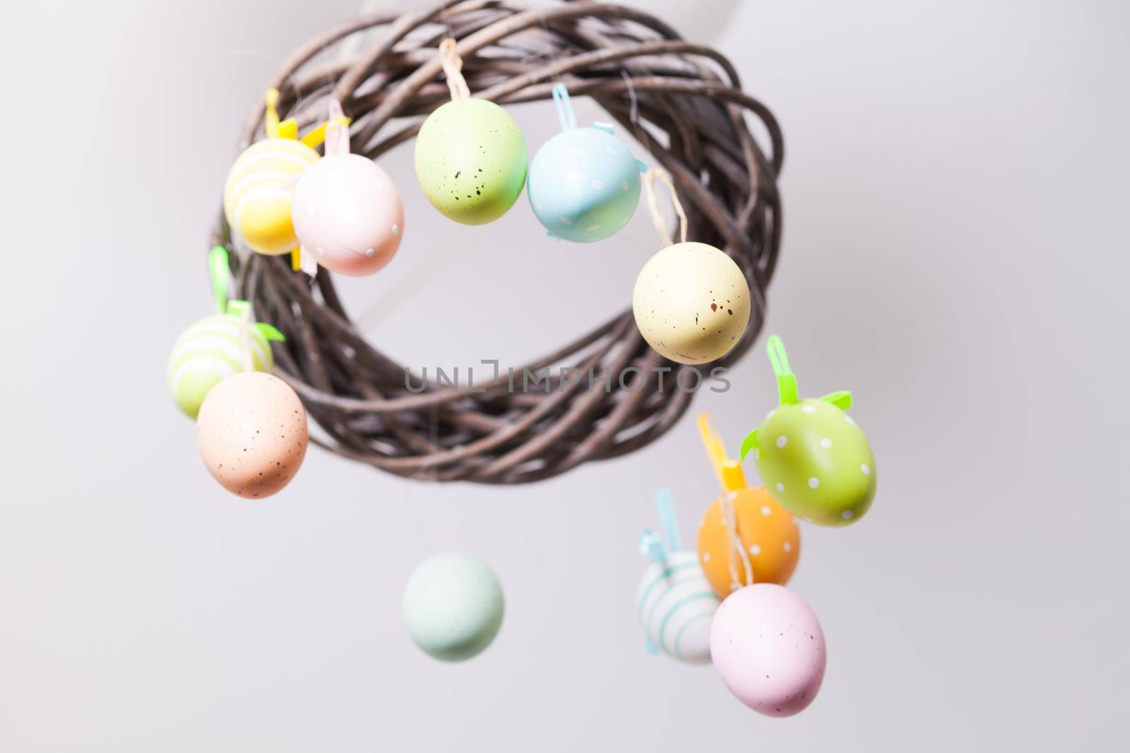 Easter wreath with color eggs on ribbons