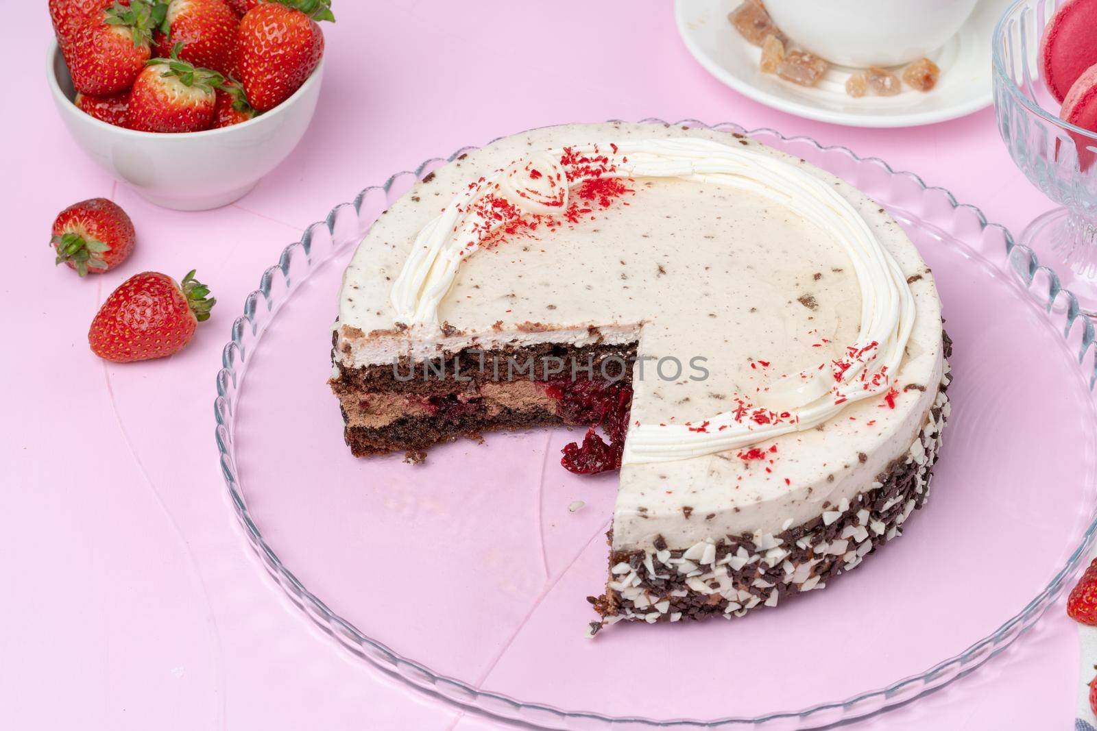 Chocolate cake with whipped cream icing on plate. High quality photo