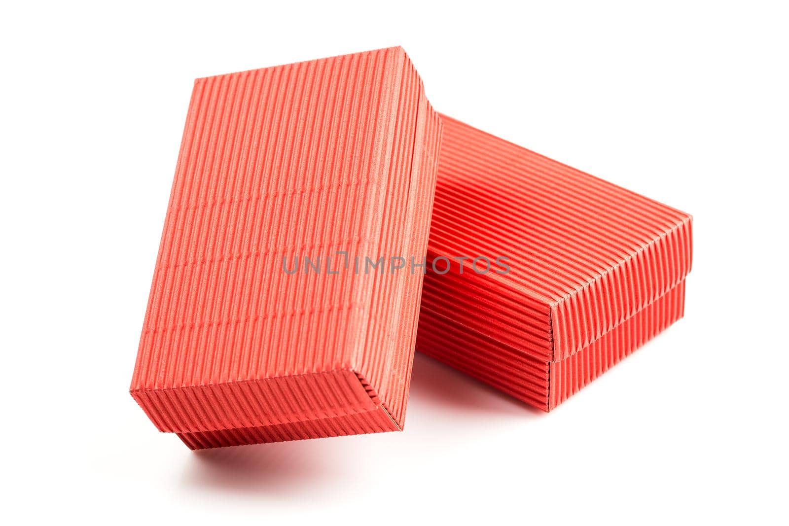 Two red closed corrugated cardboard boxes isolated on white. Valentine's Day gift box packaging concept