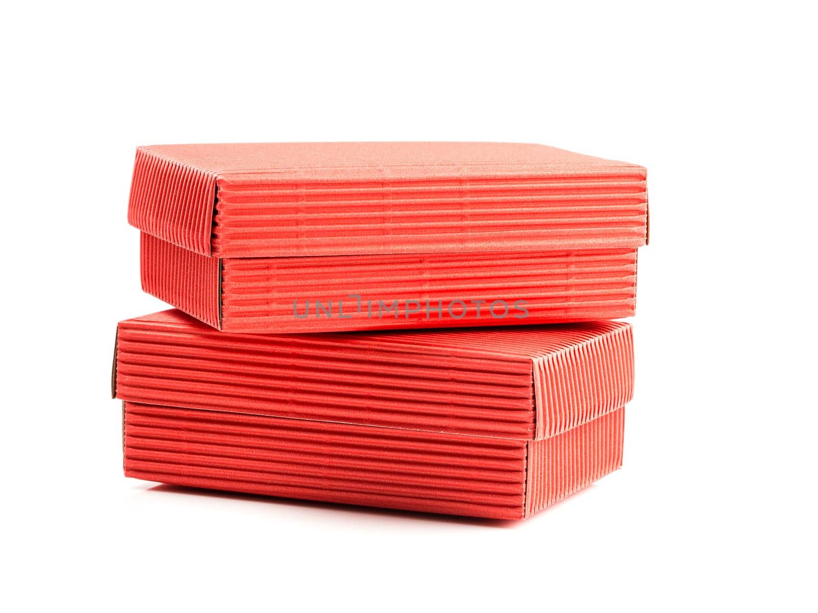 Two red closed corrugated cardboard boxes isolated on white. Valentine's Day gift box packaging concept