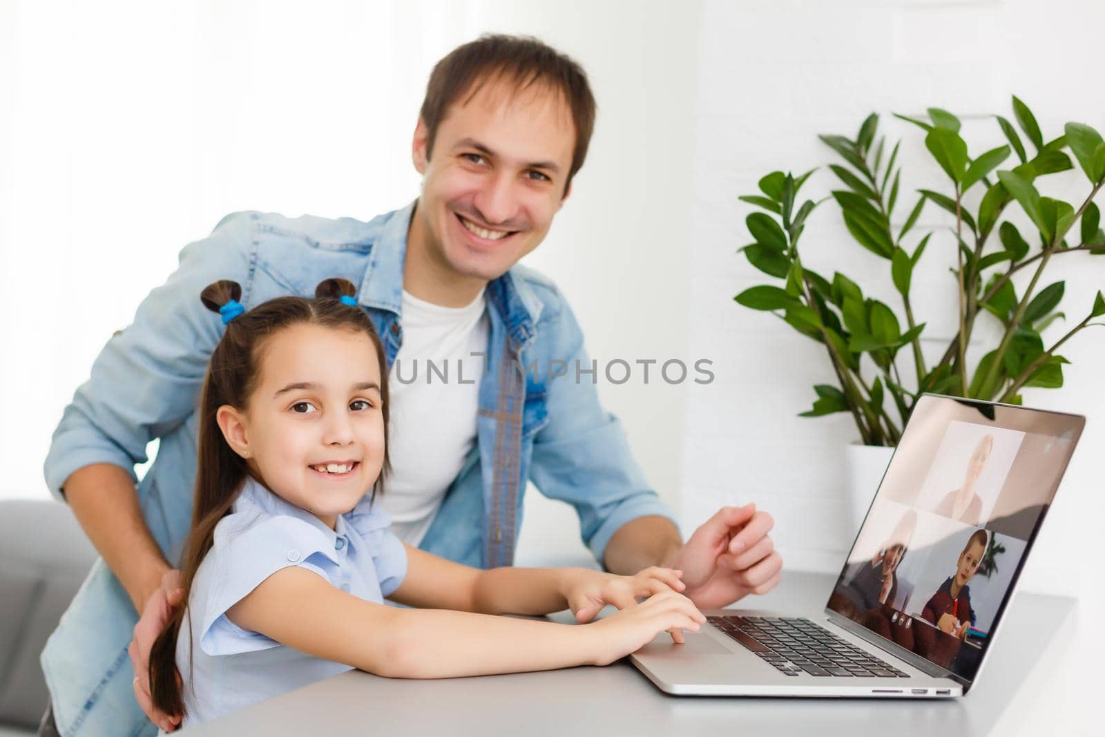 Digital composite of People using a computer with E-Learning information in the screen