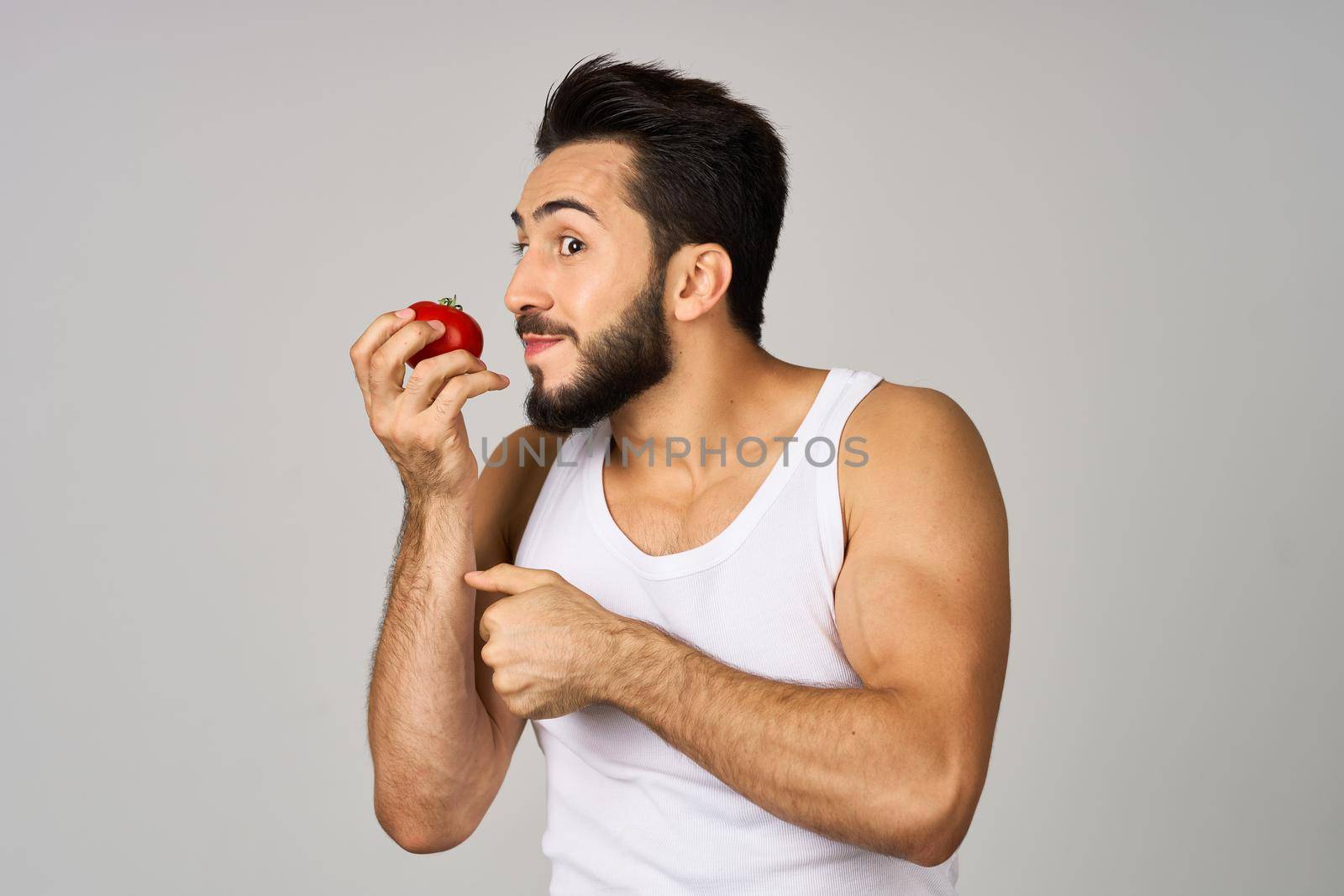 bearded man fresh tomatoes healthy lifestyle diet food studio lifestyle by Vichizh