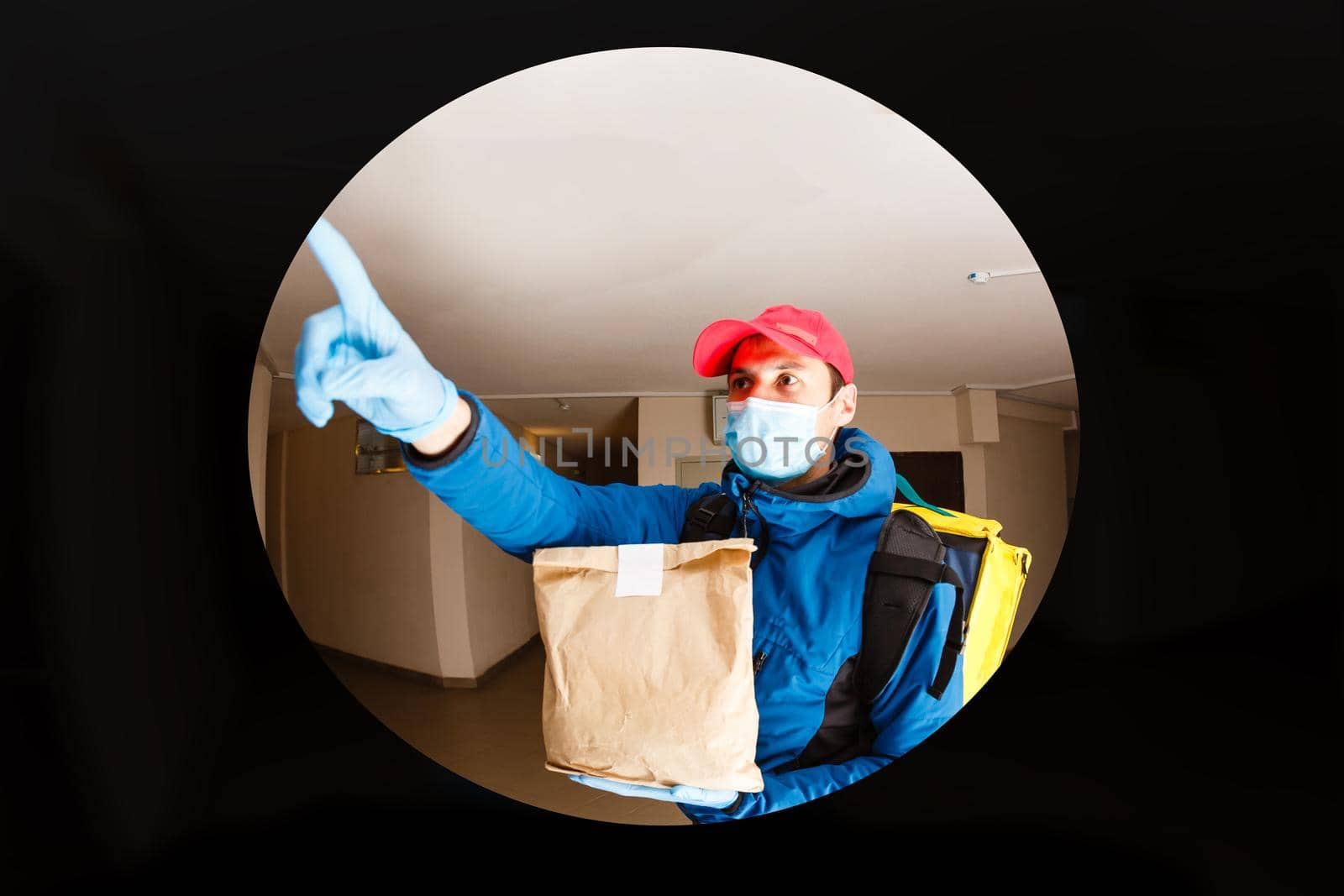 delivery man send food bag at door knob for contactless or contact free from delivery rider in front house for social distancing for infection risk. by Andelov13