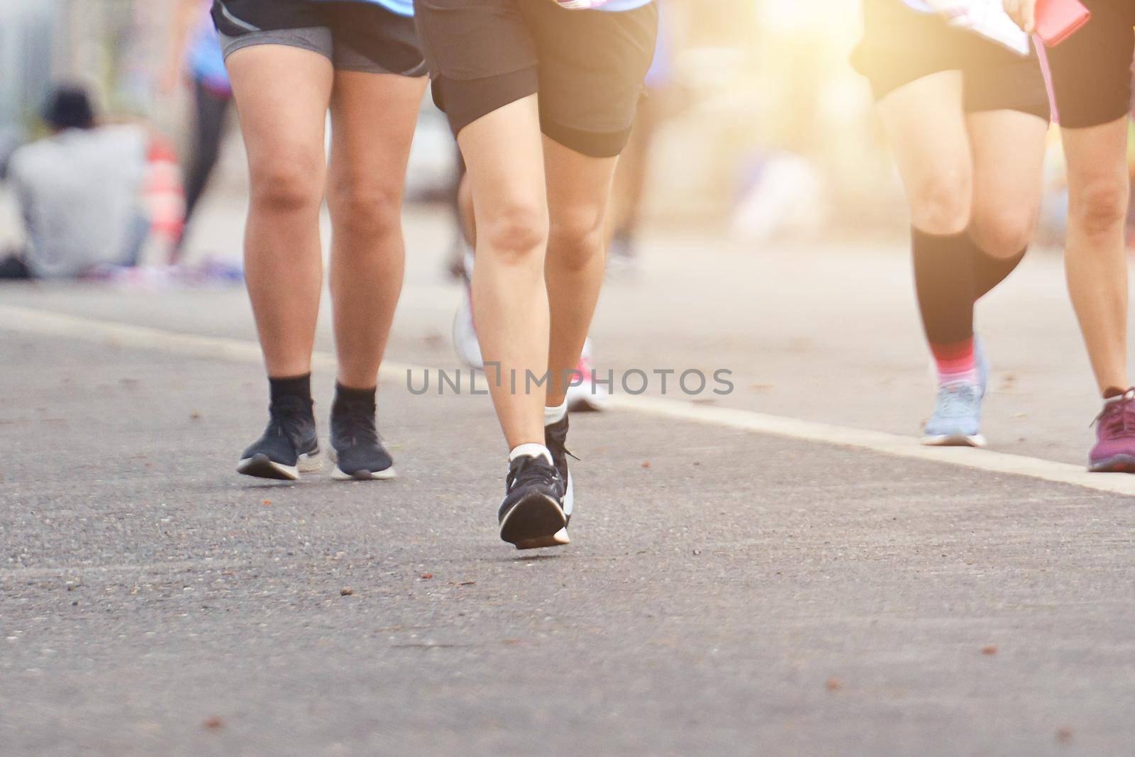 Marathon Running In The Light Of Evening, Healthy Group Of People Jogging On Tracking Road, Fitness Running To Lose Weight.