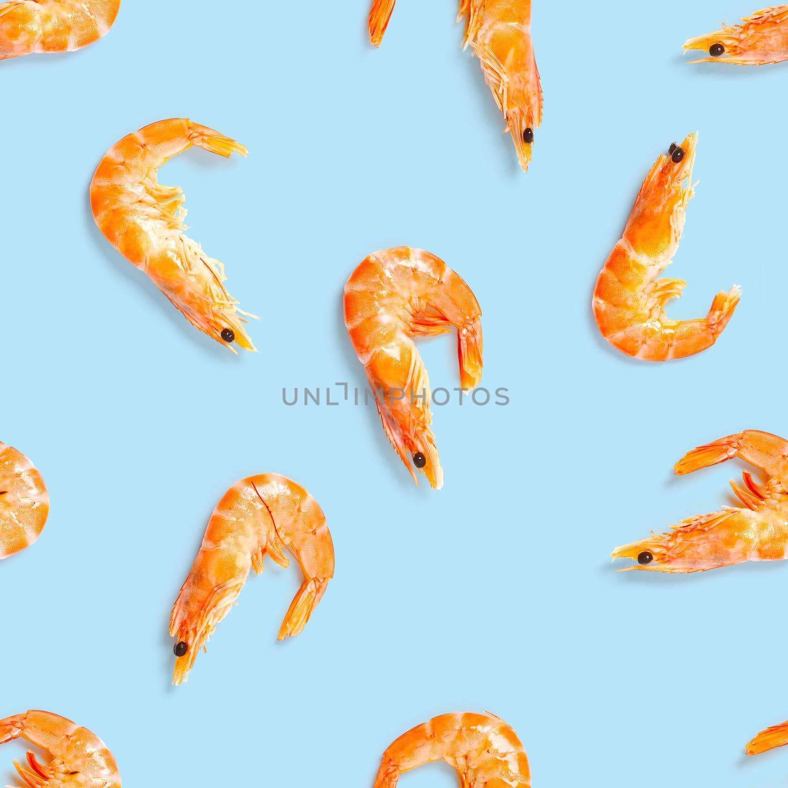 Seamless pattern made from Prawn isolated on a blue background. Tiger shrimp. Seafood seamless pattern with shrimps. seafood pattern