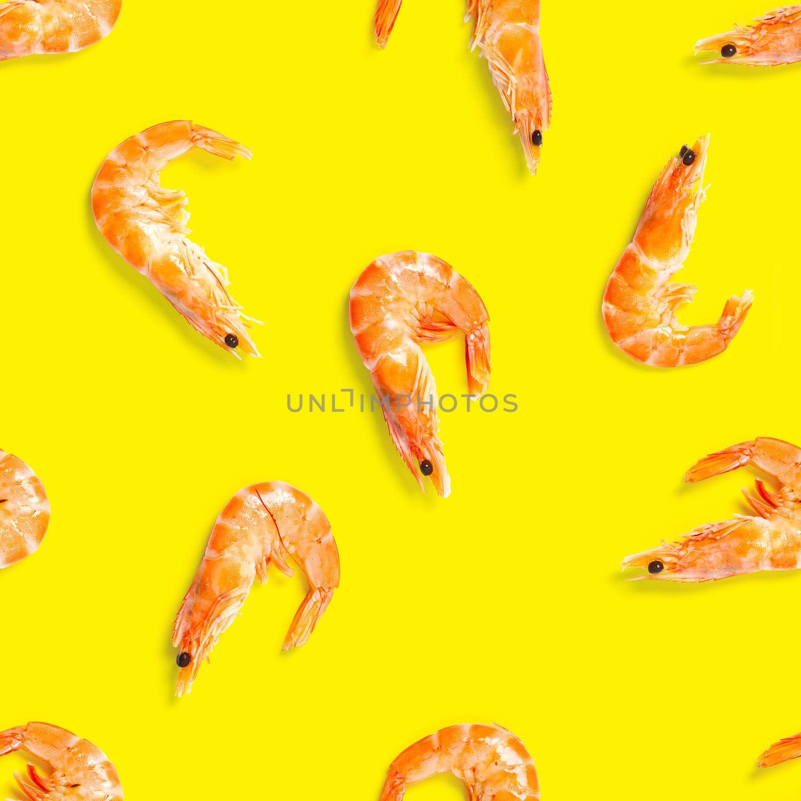 Seamless pattern made from Prawn isolated on a yellow background. Tiger shrimp. Seafood seamless pattern with shrimps. seafood pattern